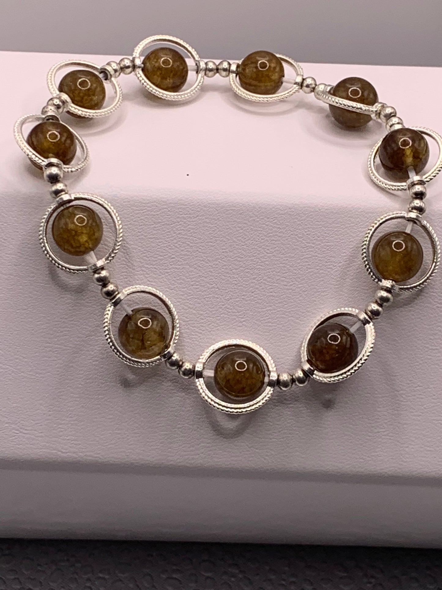 Brown tourmaline semi precious stone/crystal elastic beaded bracelet with silver colored rings