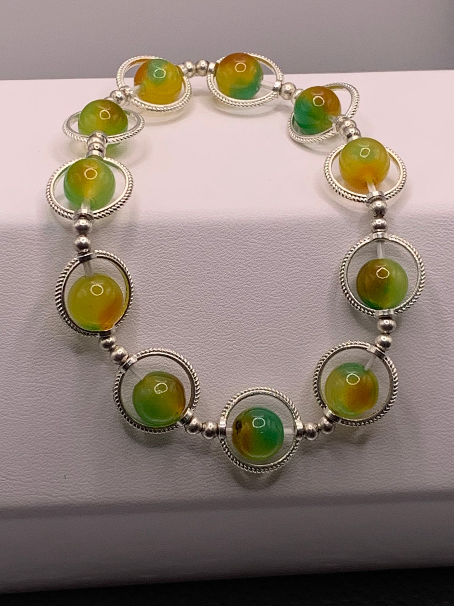 Yellow green chalcedony semi precious stone/crystal elastic beaded bracelet with silver colored rings