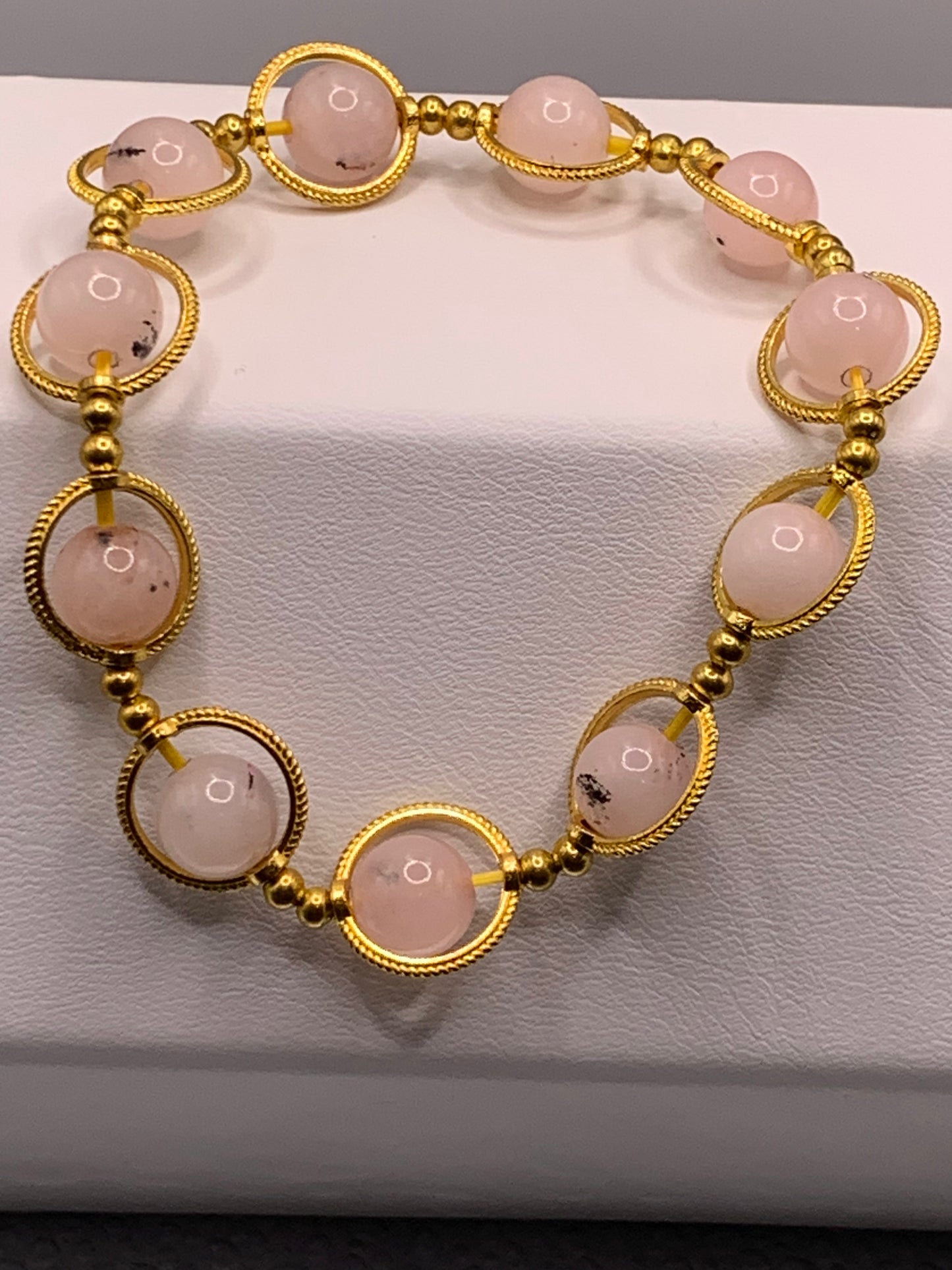 Pink opal chalcedony semi precious stone/crystal elastic beaded bracelet with gold colored rings