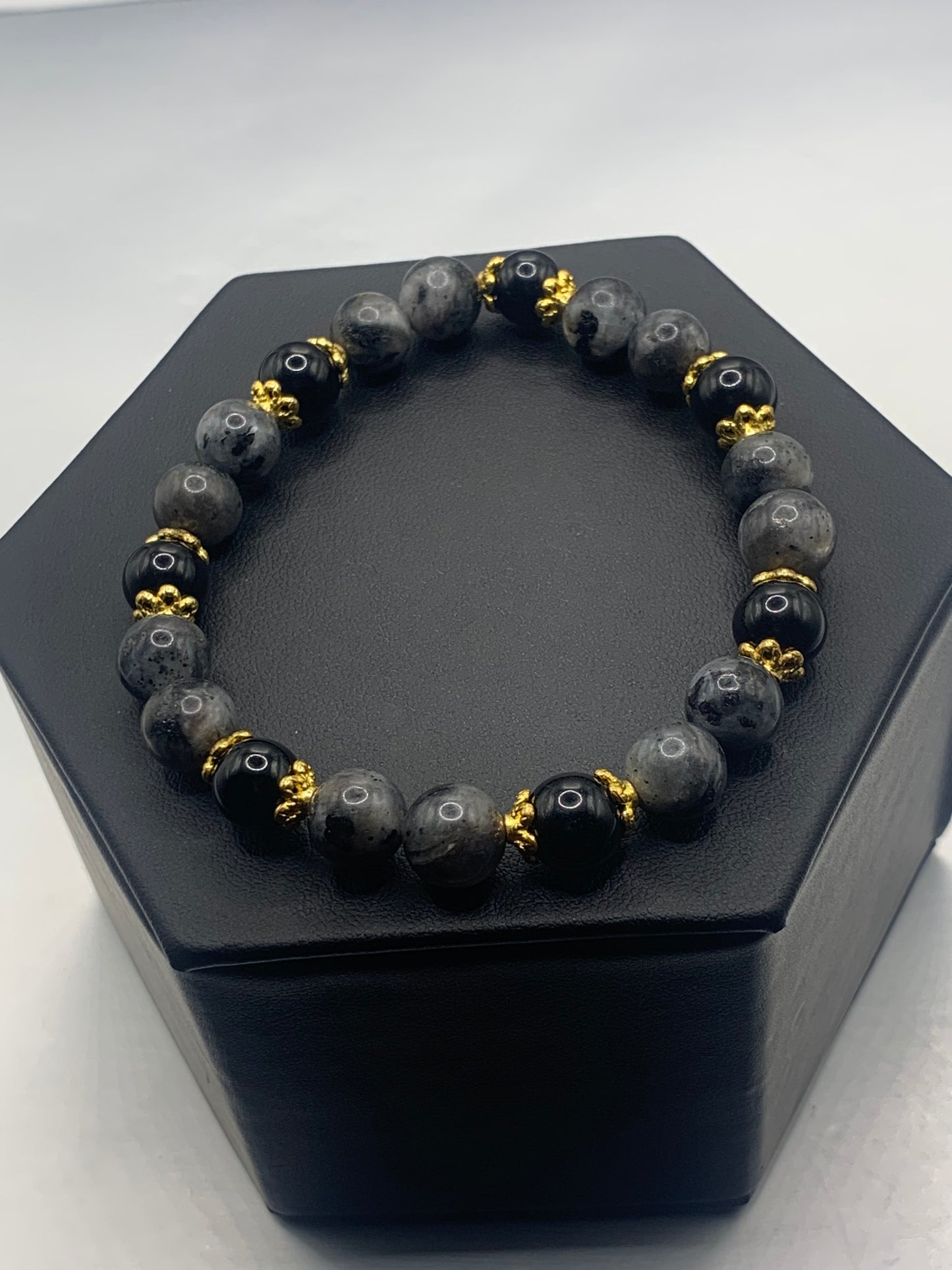 Black obsidian with larvikite semi precious stone/crystal beaded elastic bracelet with gold plated flower bead caps