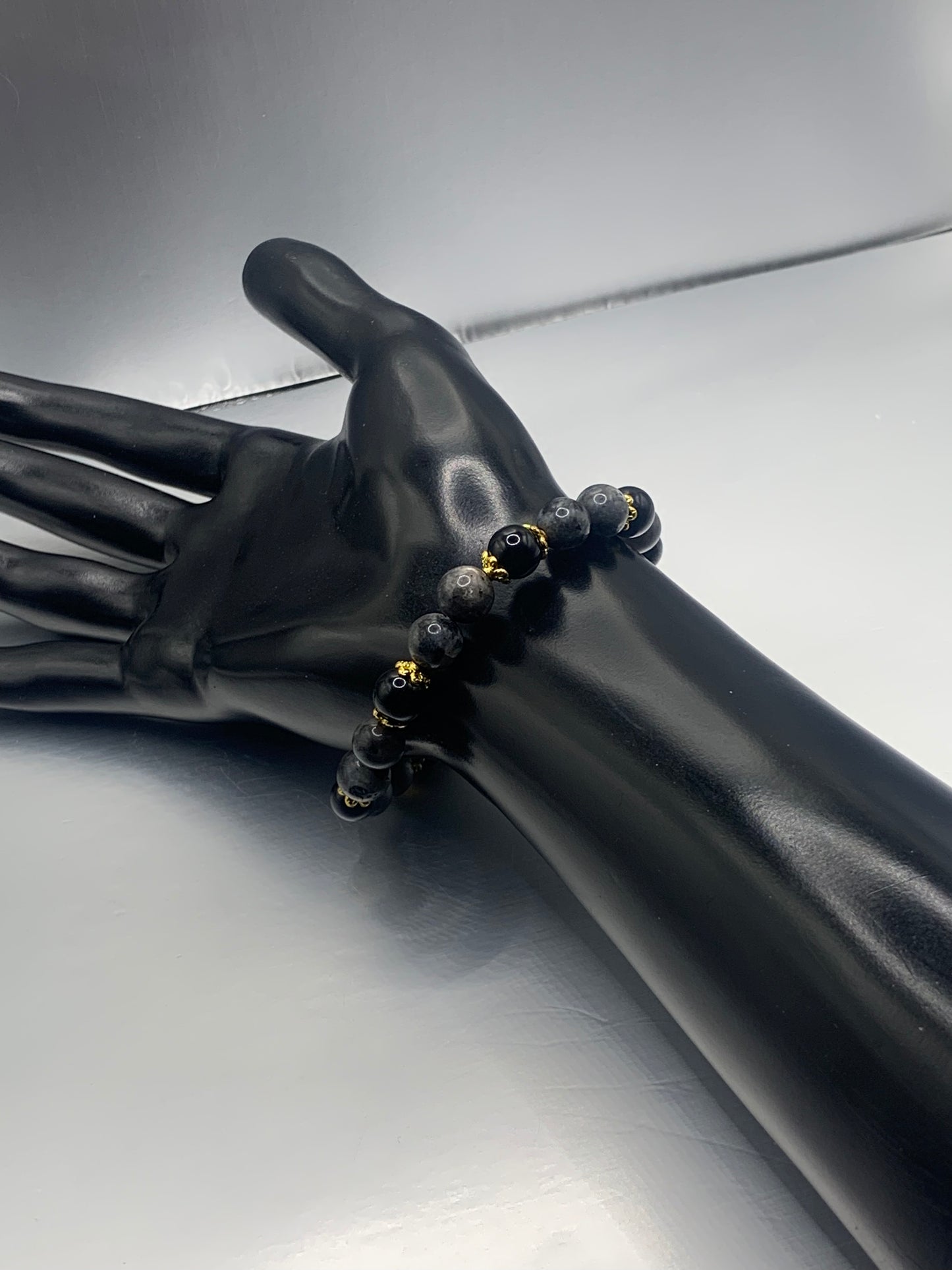 Black obsidian with larvikite semi precious stone/crystal beaded elastic bracelet with gold plated flower bead caps