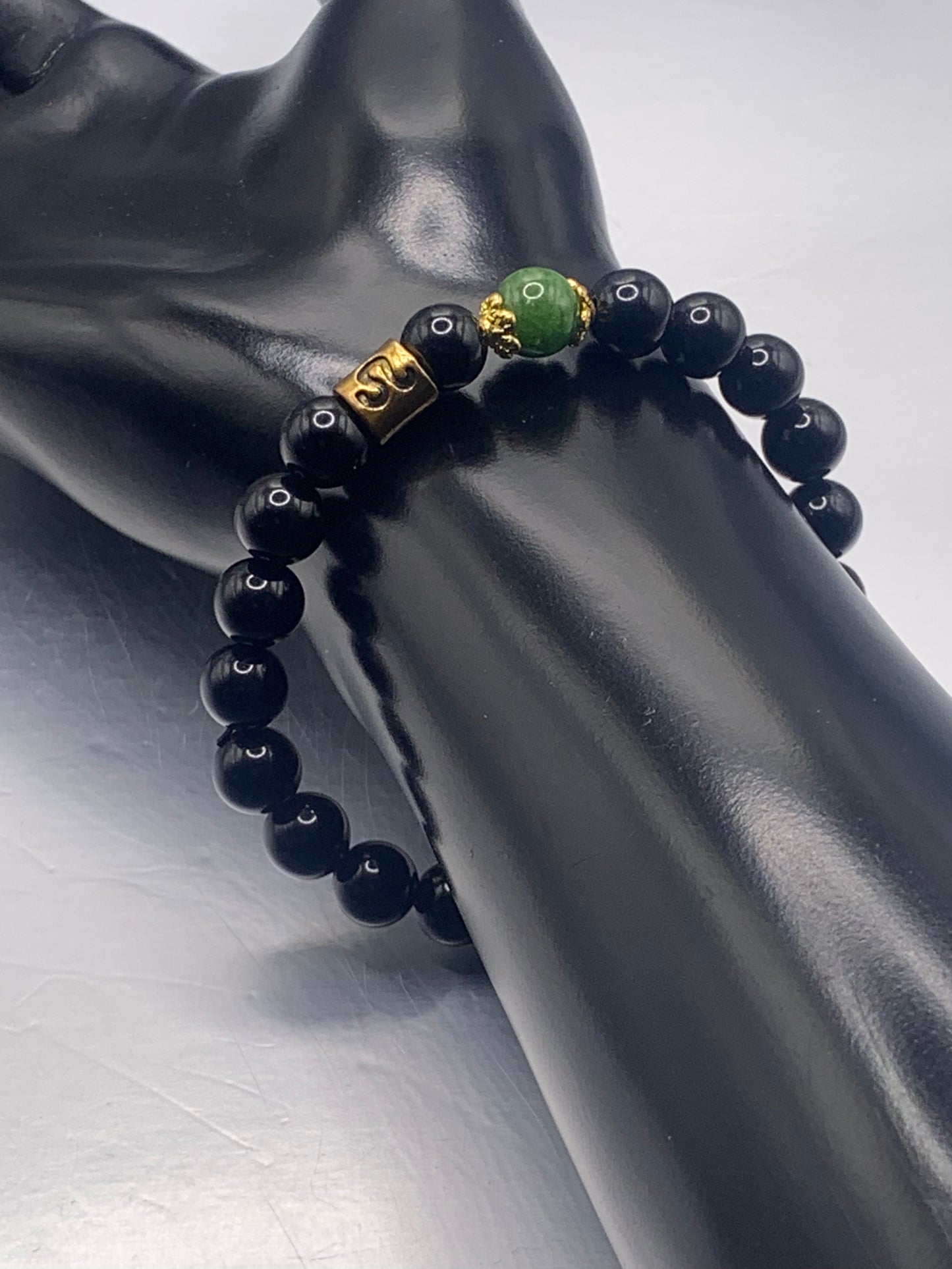 Leo Zodiac black obsidian with green tourmaline elastic beaded bracelet with gold accents