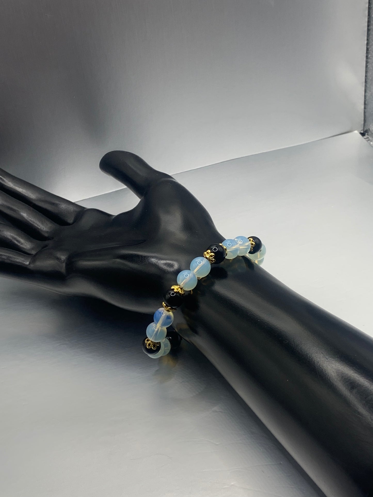 Black obsidian with opalite semi precious stone/crystal beaded elastic bracelet with gold plated flower bead caps