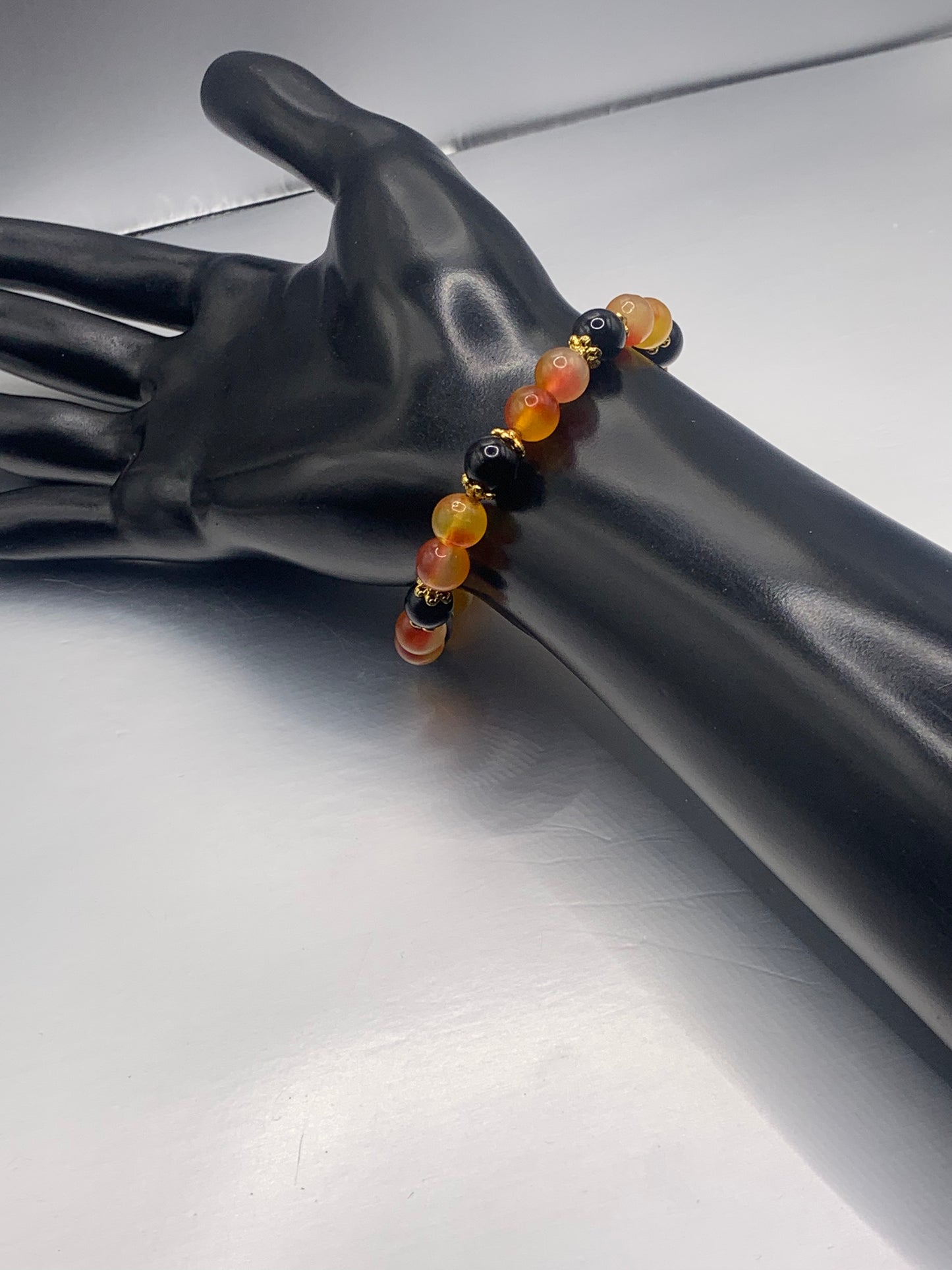 Black obsidian with orange blossom chalcedony semi precious stone/crystal beaded elastic bracelet with gold plated flower bead caps
