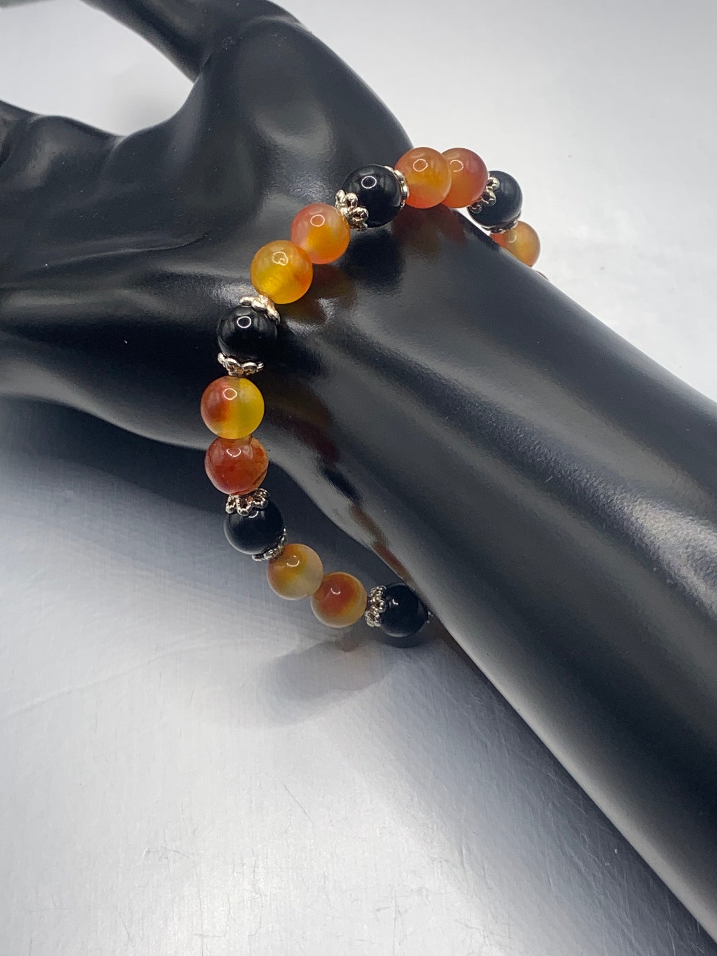 Black obsidian with orange blossom chalcedony semi precious stone/crystal beaded elastic bracelet with silver plated flower bead caps