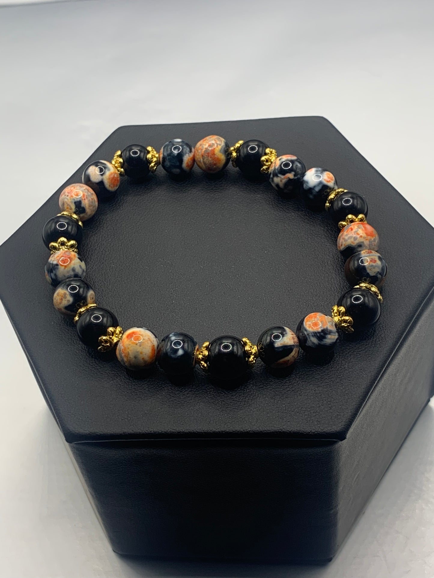 Black obsidian with orange orca agate semi precious stone/crystal beaded elastic bracelet with gold plated flower bead caps