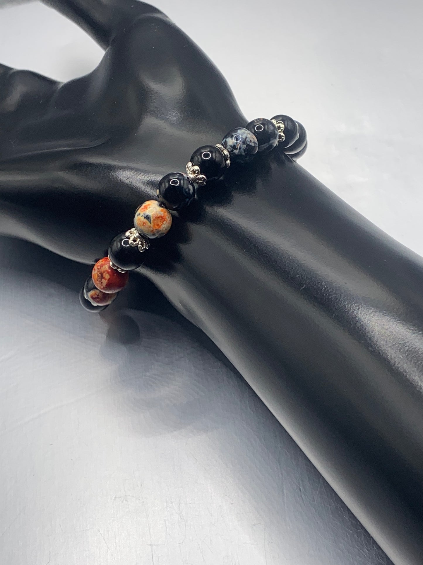 Black obsidian with orange orca agate semi precious stone/crystal beaded elastic bracelet with silver plated flower bead caps
