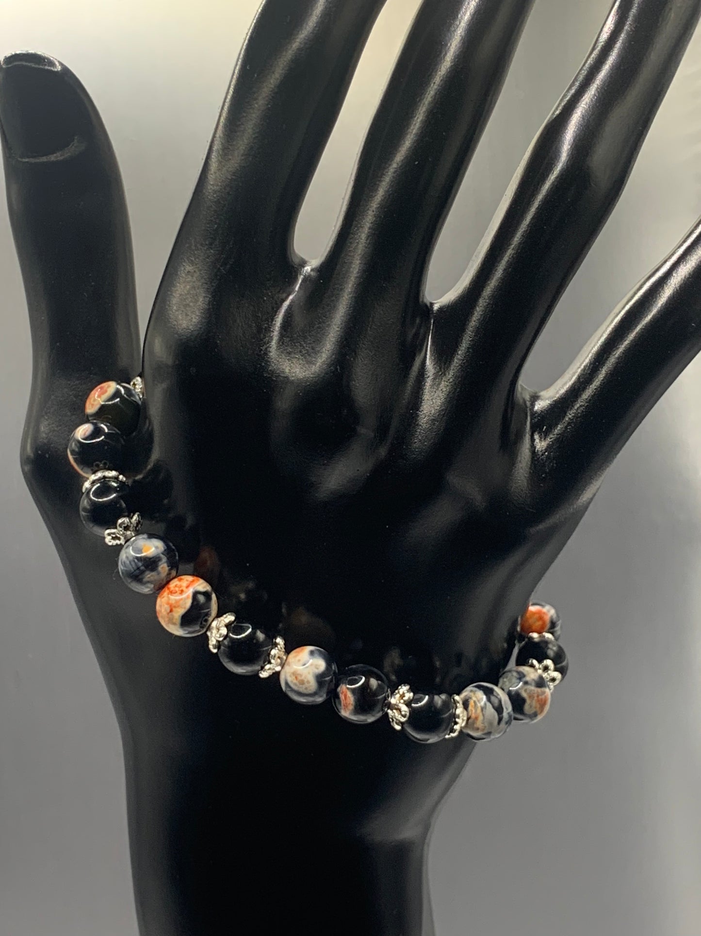 Black obsidian with orange orca agate semi precious stone/crystal beaded elastic bracelet with silver plated flower bead caps
