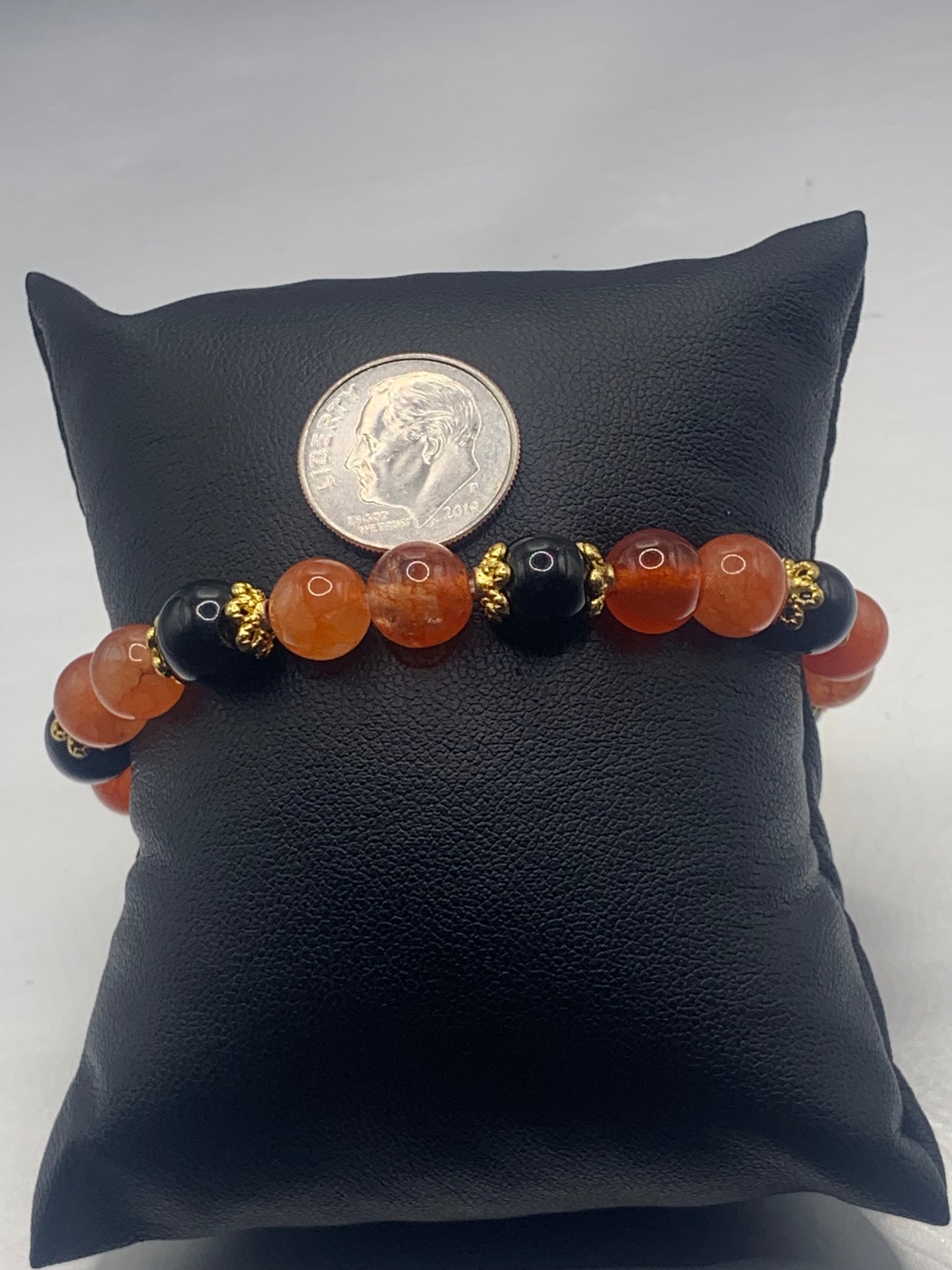 Black obsidian with phoenix agate semi precious stone/crystal beaded elastic bracelet with gold plated flower bead caps