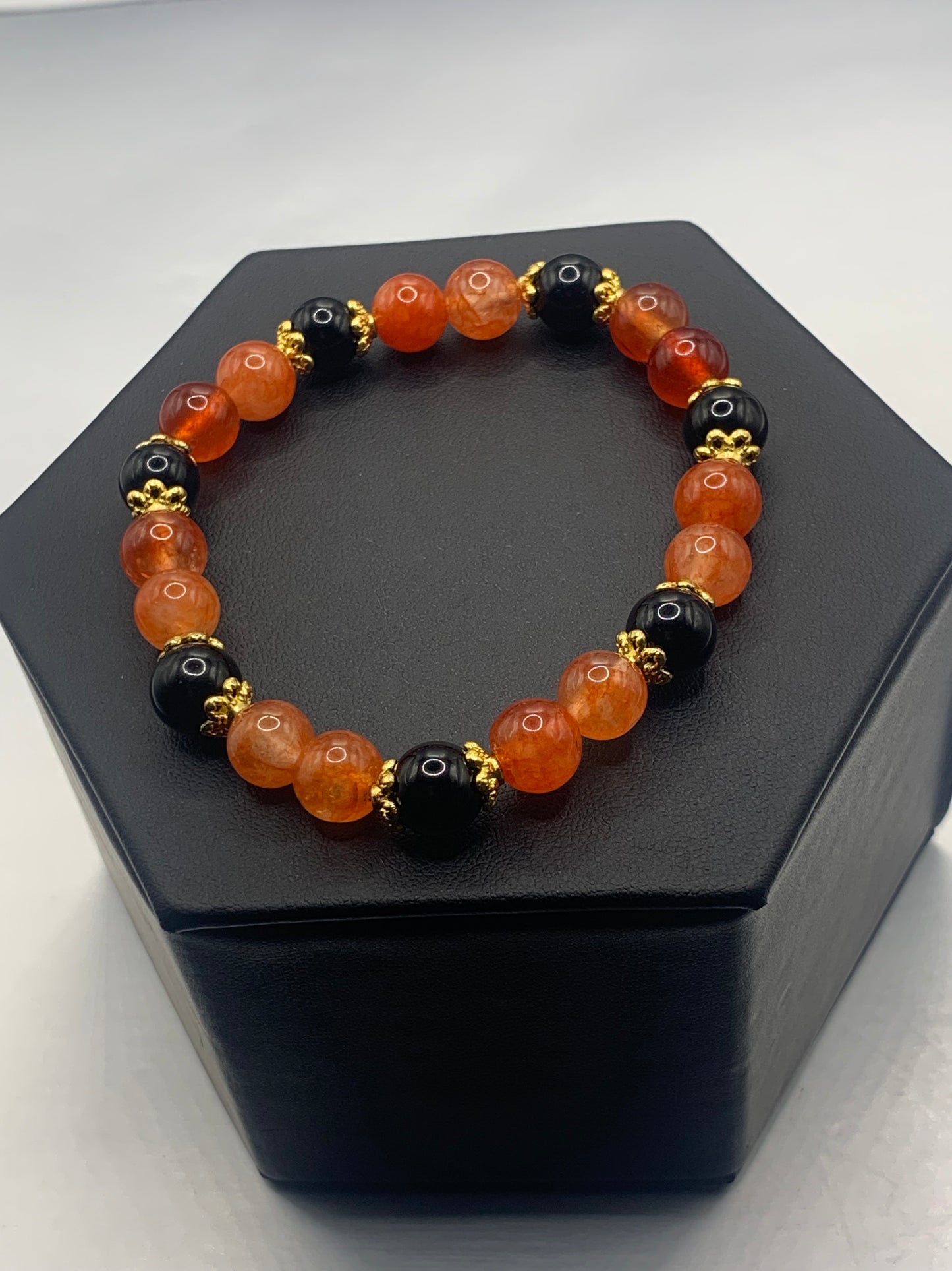 Black obsidian with phoenix agate semi precious stone/crystal beaded elastic bracelet with gold plated flower bead caps