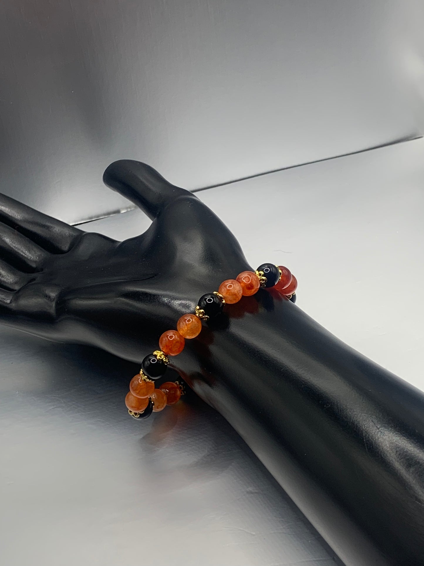 Black obsidian with phoenix agate semi precious stone/crystal beaded elastic bracelet with gold plated flower bead caps
