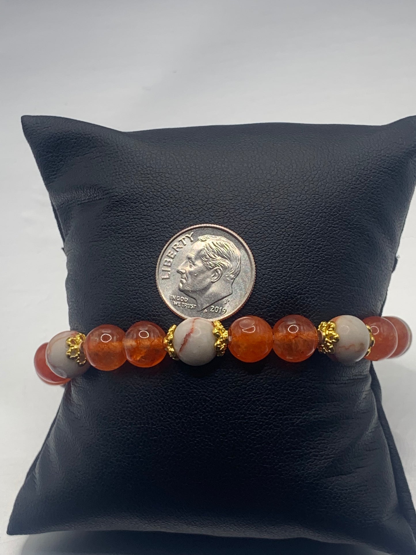 Red vein jasper and phoenix agate semi precious stone/crystal elastic beaded bracelet with gold plated flower bead caps