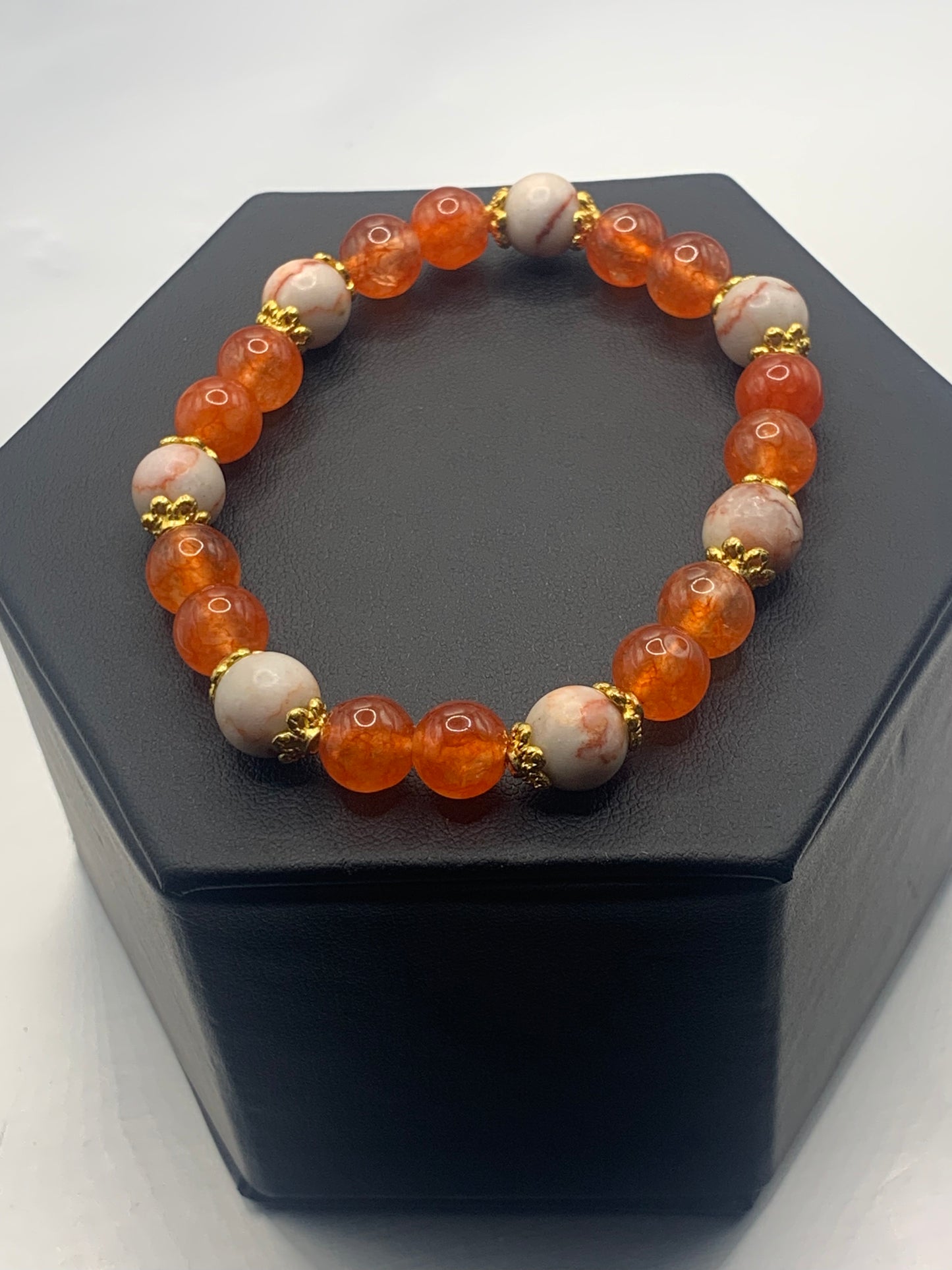 Red vein jasper and phoenix agate semi precious stone/crystal elastic beaded bracelet with gold plated flower bead caps
