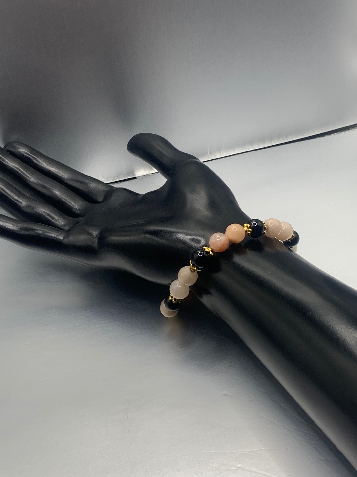 Black obsidian with pink aventurine semi precious stone/crystal beaded elastic bracelet with gold plated flower bead caps
