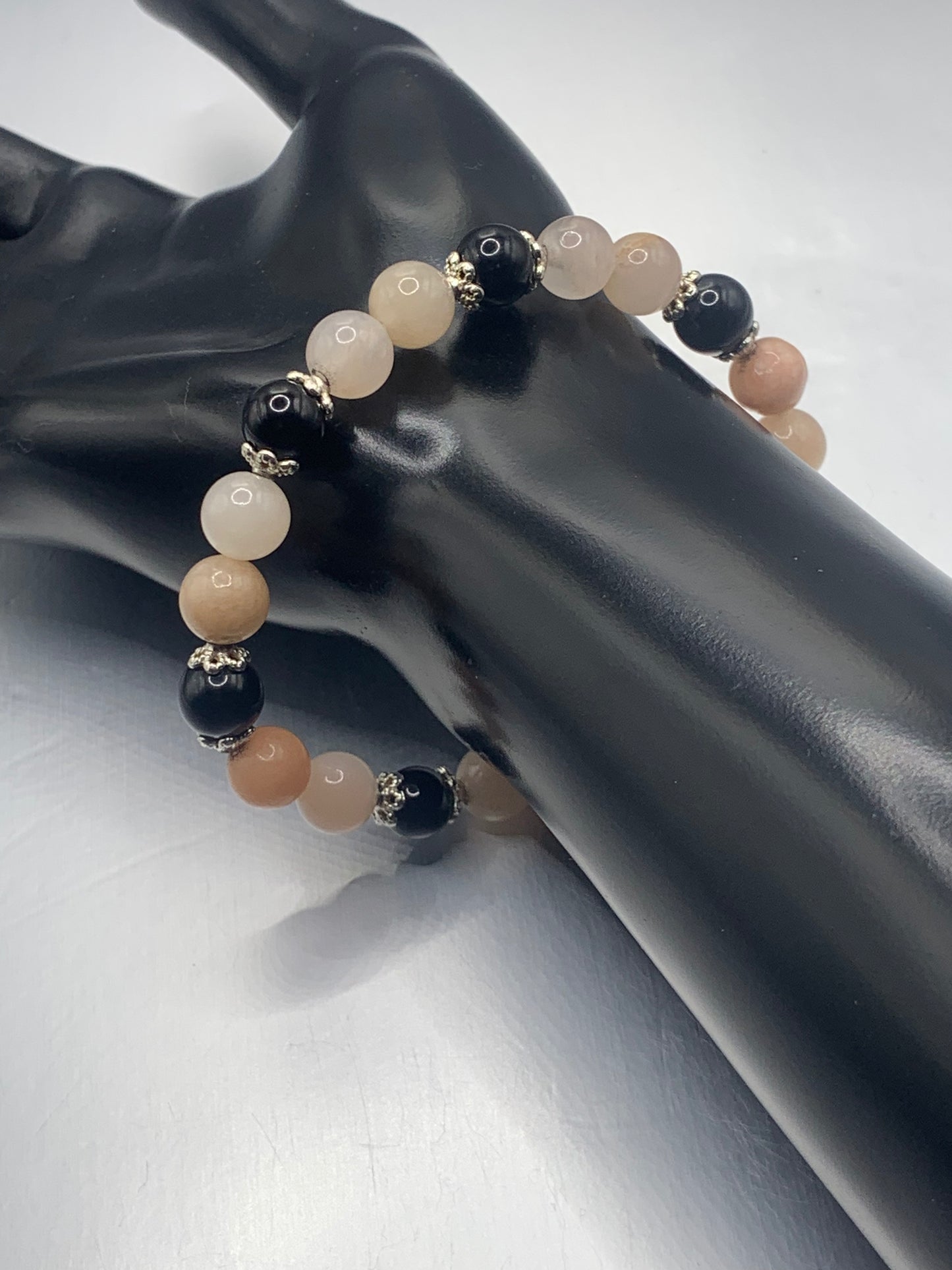 Black obsidian with pink aventurine semi precious stone/crystal beaded elastic bracelet with silver plated flower bead caps
