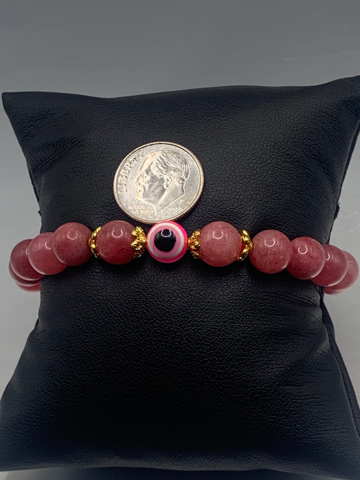 Pink chalcedony semi precious stone/crystal with resin evil eye beaded elastic bracelet