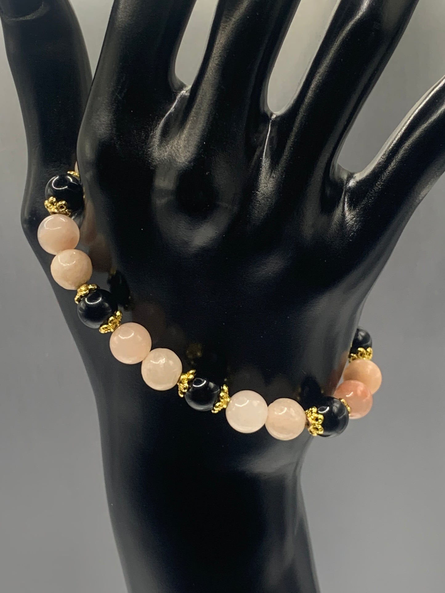 Black obsidian with pink aventurine semi precious stone/crystal beaded elastic bracelet with gold plated flower bead caps