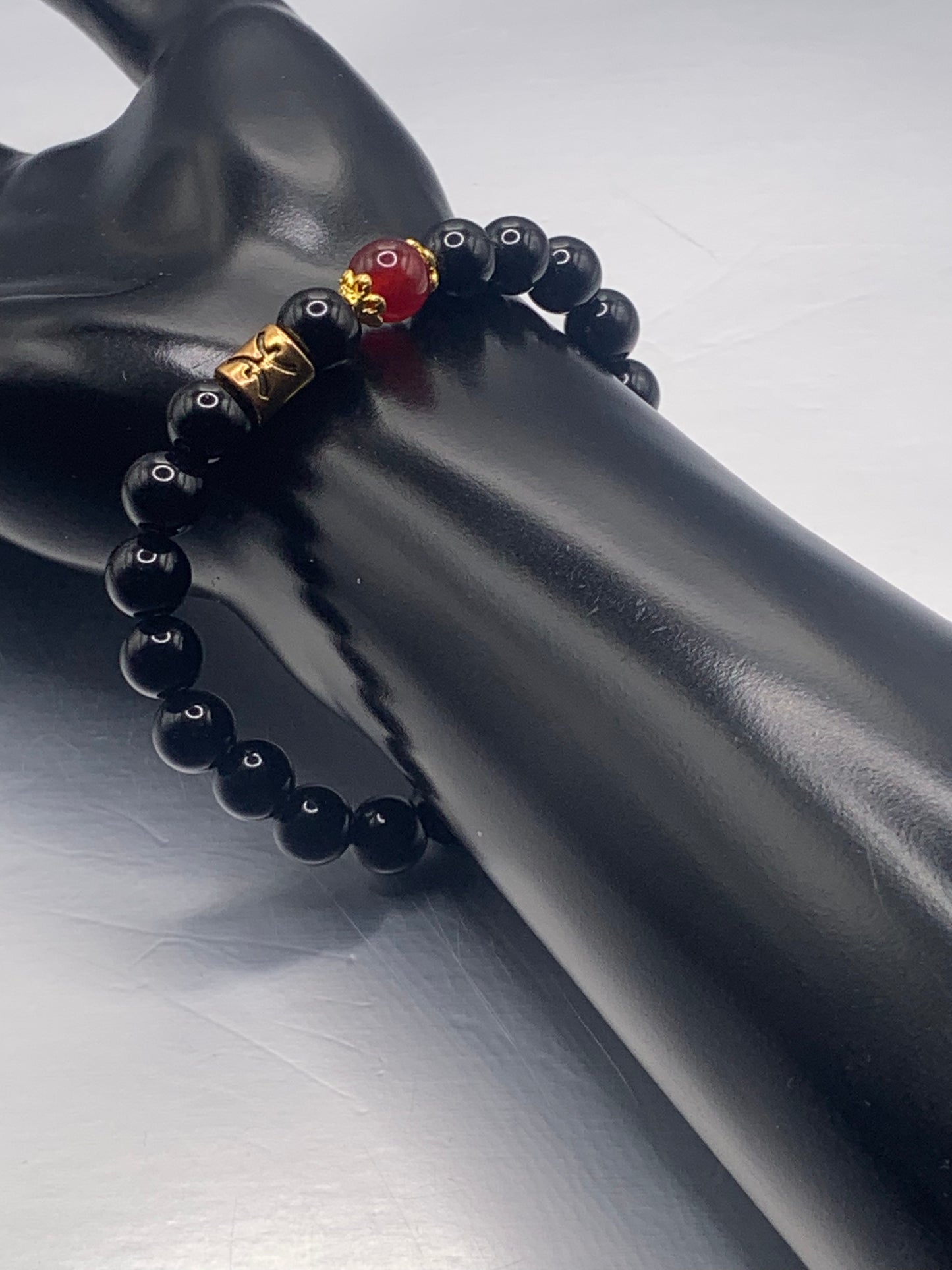 Pisces Zodiac black obsidian with red chalcedony elastic beaded bracelet with gold accents