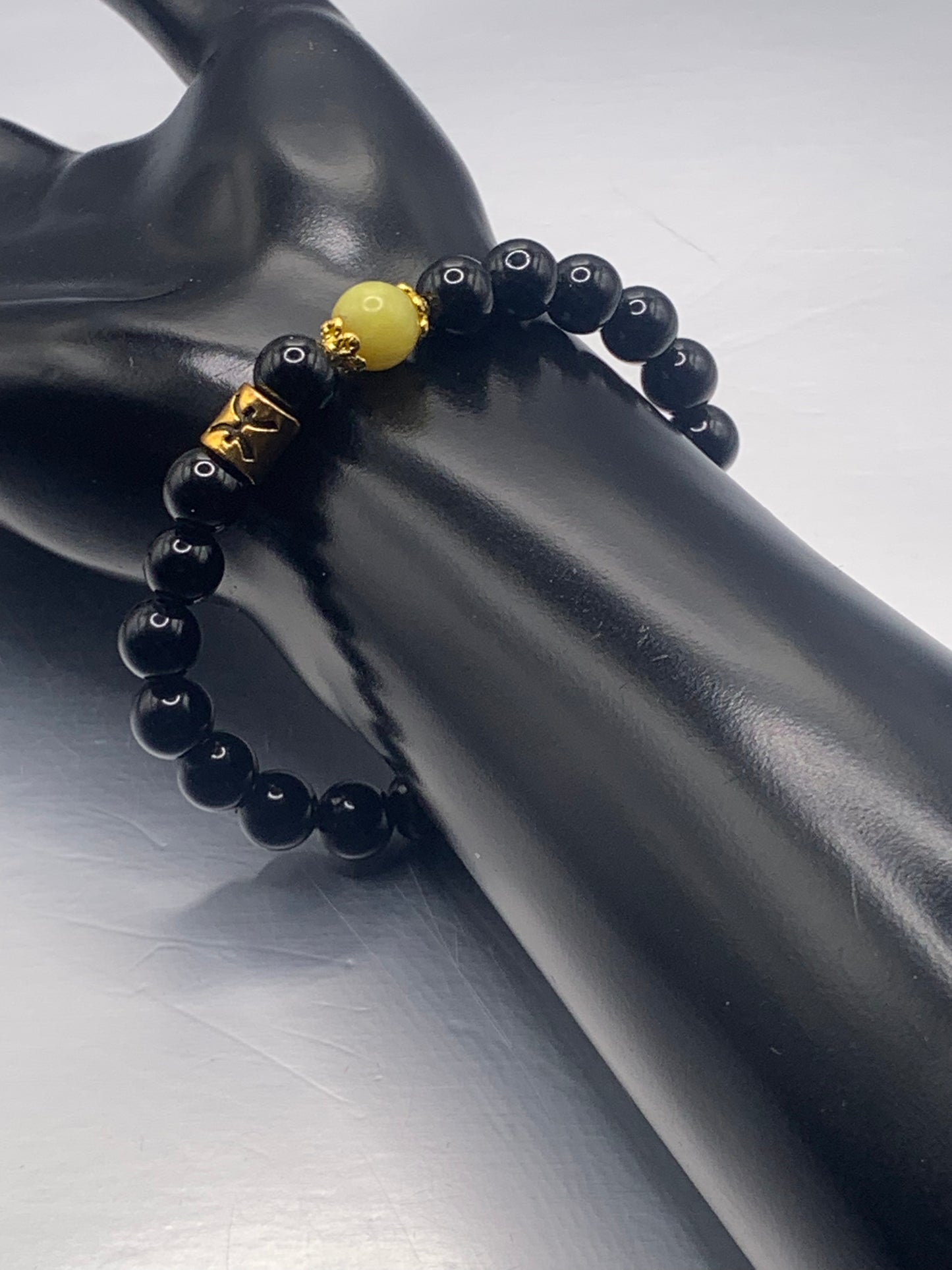 Pisces Zodiac black obsidian with yellow jade elastic beaded bracelet with gold accents