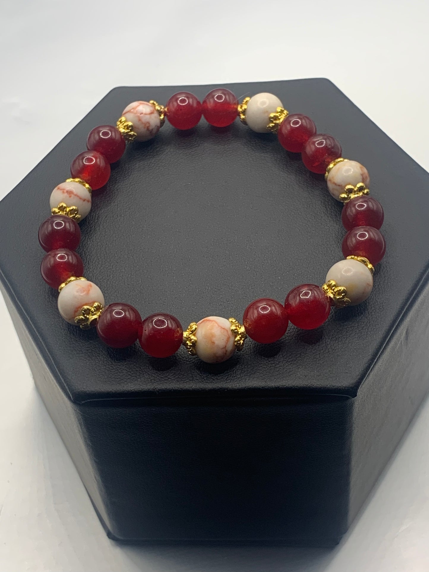 Red vein jasper and red chalcedony semi precious stone/crystal elastic beaded bracelet with gold plated flower bead caps