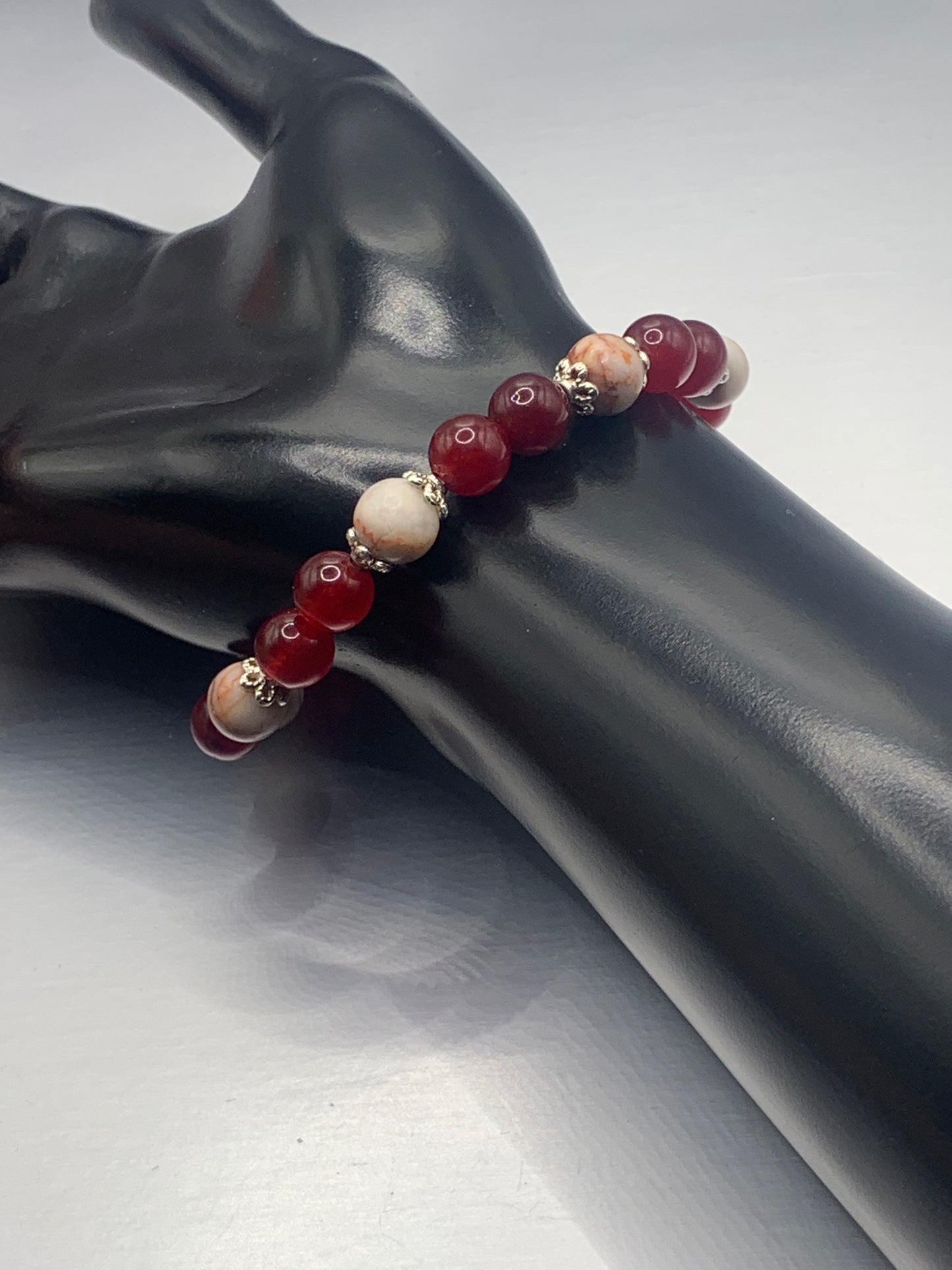 Red vein jasper and red chalcedony semi precious stone/crystal elastic beaded bracelet with silver plated flower bead caps