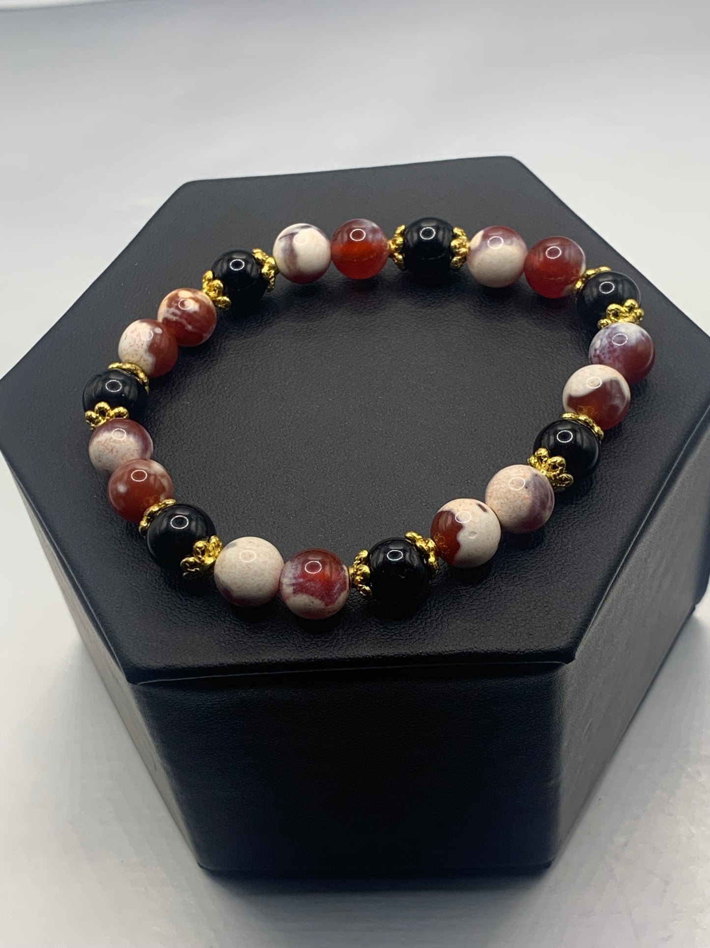 Black obsidian with red white orca agate semi precious stone/crystal beaded elastic bracelet with gold plated flower bead caps