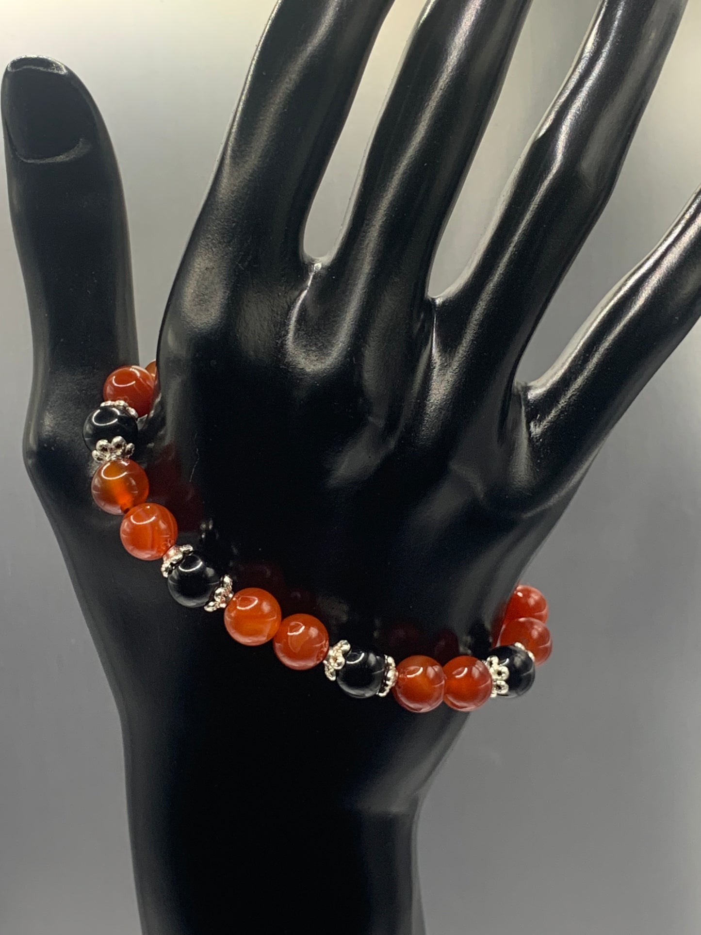 Black obsidian with red agate semi precious stone/crystal beaded elastic bracelet with silver plated flower bead caps