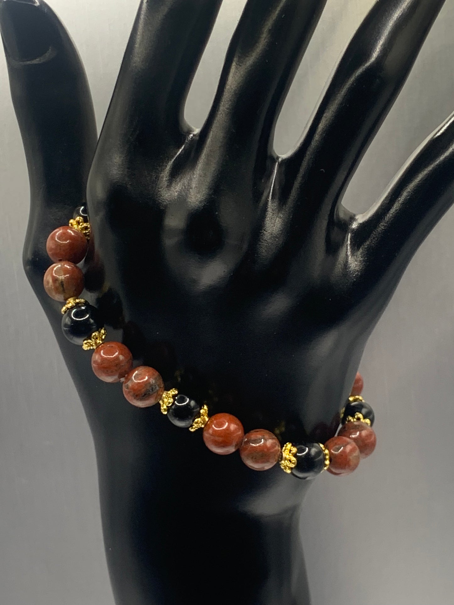 Black obsidian with red sesame jasper semi precious stone/crystal beaded elastic bracelet with gold plated flower bead caps