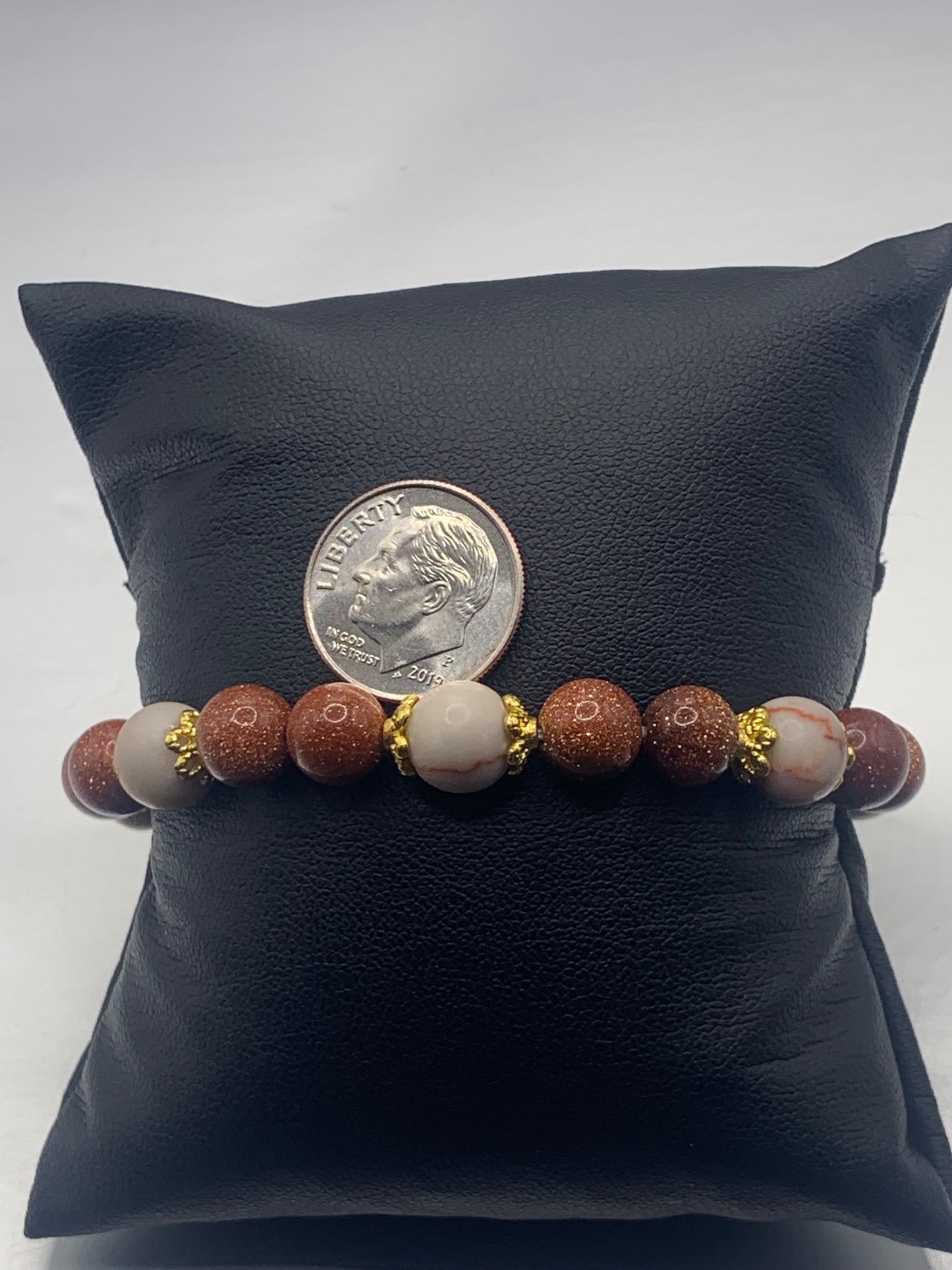 Red vein jasper and sandstone semi precious stone/crystal elastic beaded bracelet with gold plated flower bead caps