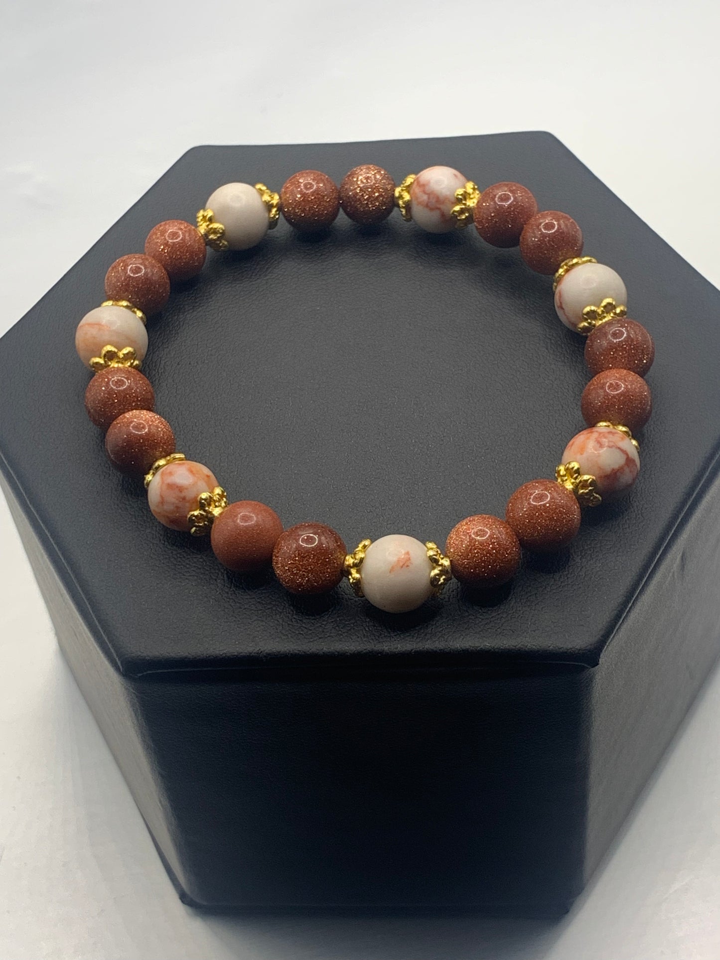 Red vein jasper and sandstone semi precious stone/crystal elastic beaded bracelet with gold plated flower bead caps
