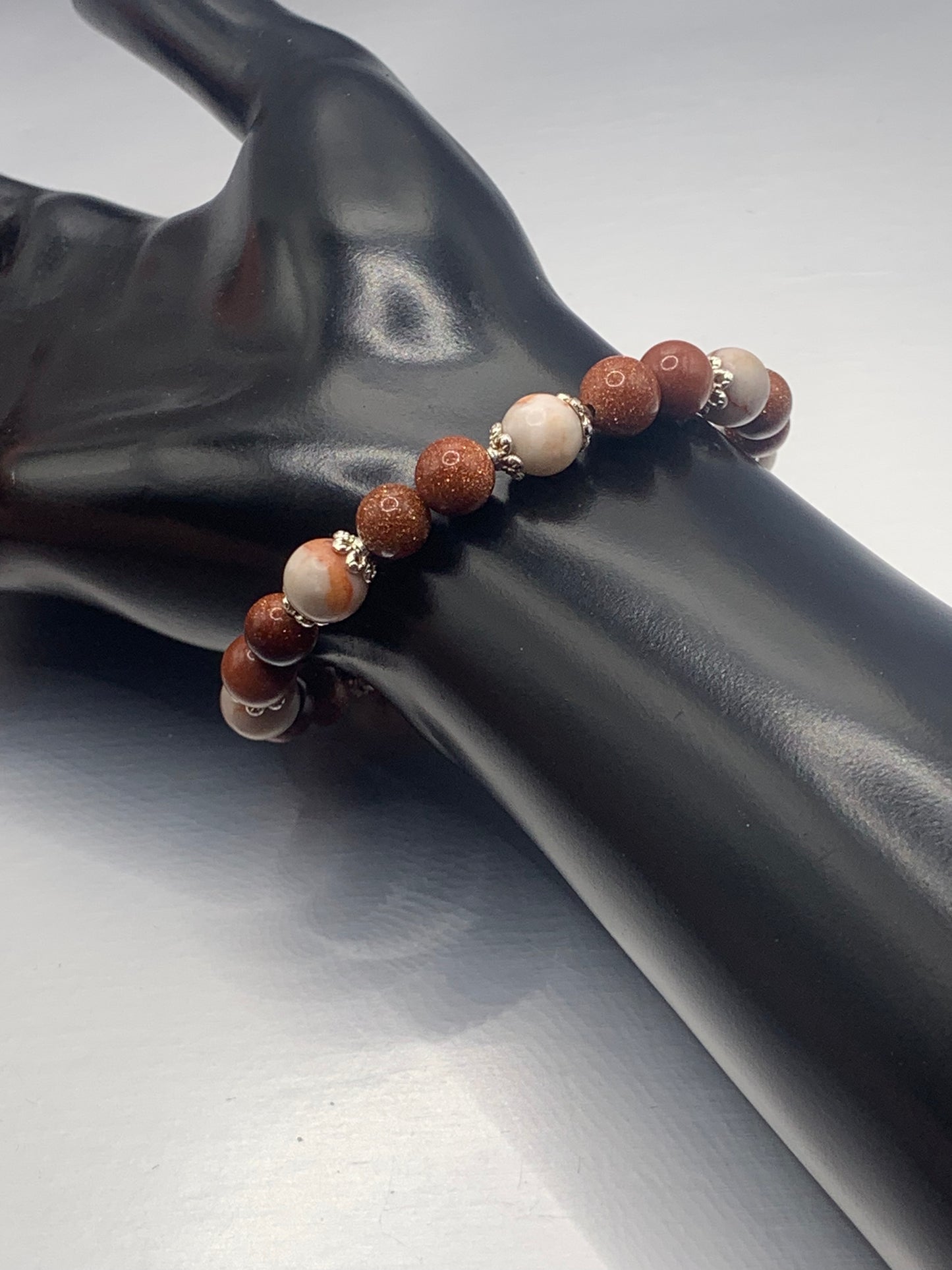 Red vein jasper and sandstone semi precious stone/crystal elastic beaded bracelet with silver plated flower bead caps