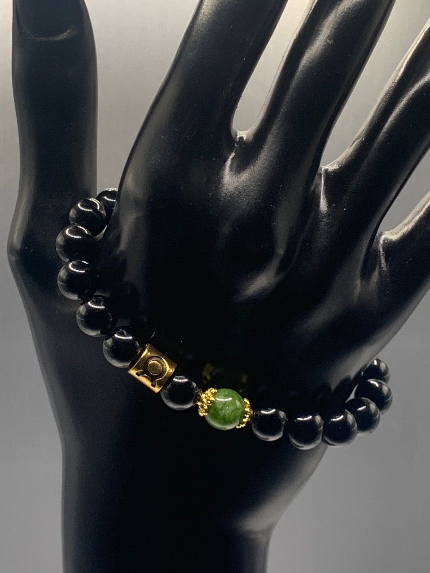 Taurus Zodiac black obsidian with green tourmaline semi precious stone/crystal elastic beaded bracelet with gold accents