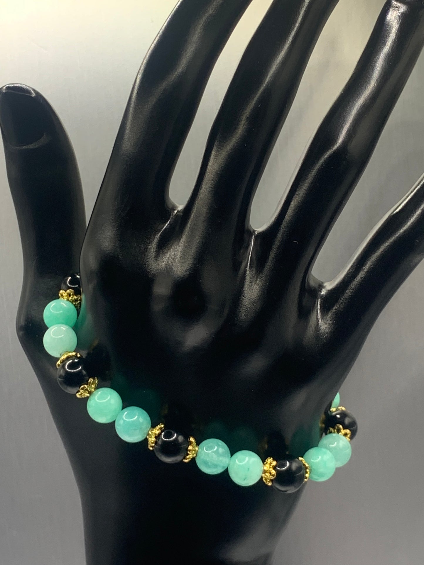 Black obsidian with teal blue chalcedony semi precious stone/crystal beaded elastic bracelet with gold plated flower bead caps