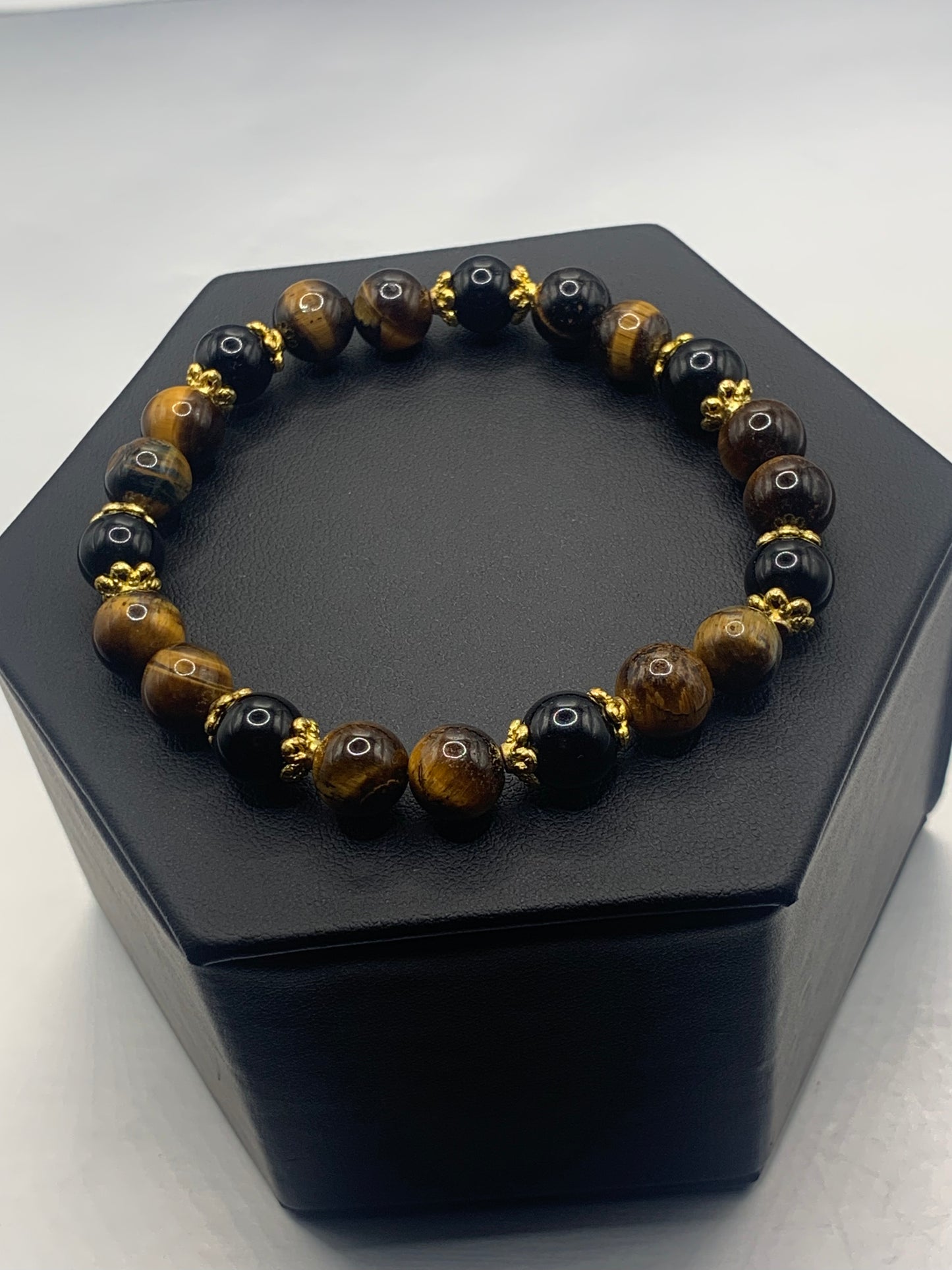 Black obsidian with tigers eye semi precious stone/crystal beaded elastic bracelet with gold plated flower bead caps