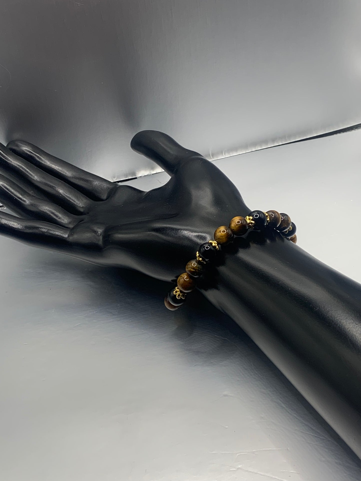 Black obsidian with tigers eye semi precious stone/crystal beaded elastic bracelet with gold plated flower bead caps