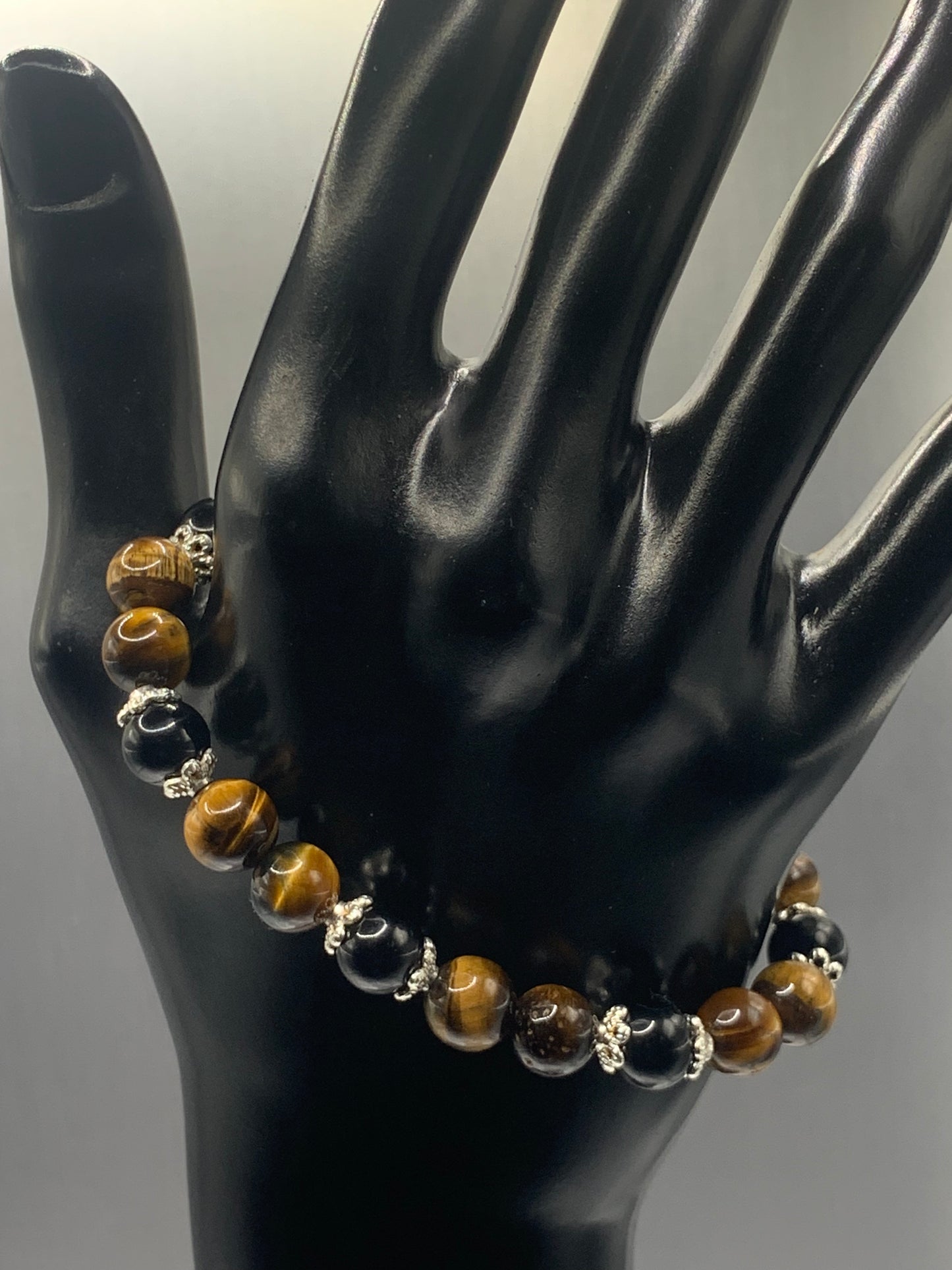 Black obsidian with tigers eye semi precious stone/crystal beaded elastic bracelet with silver plated flower bead caps