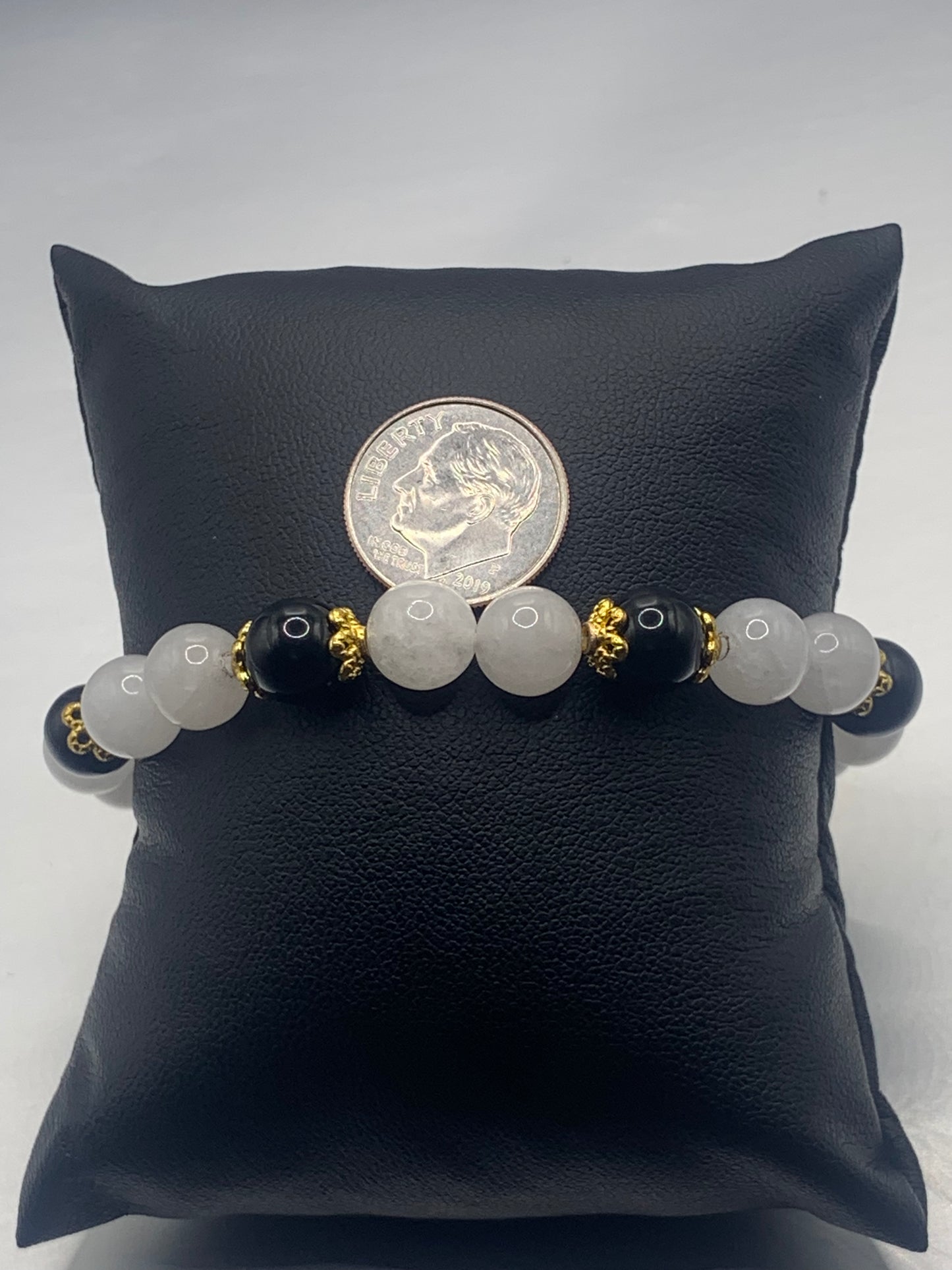 Black obsidian with white chalcedony semi precious stone/crystal beaded elastic bracelet with gold plated flower bead caps