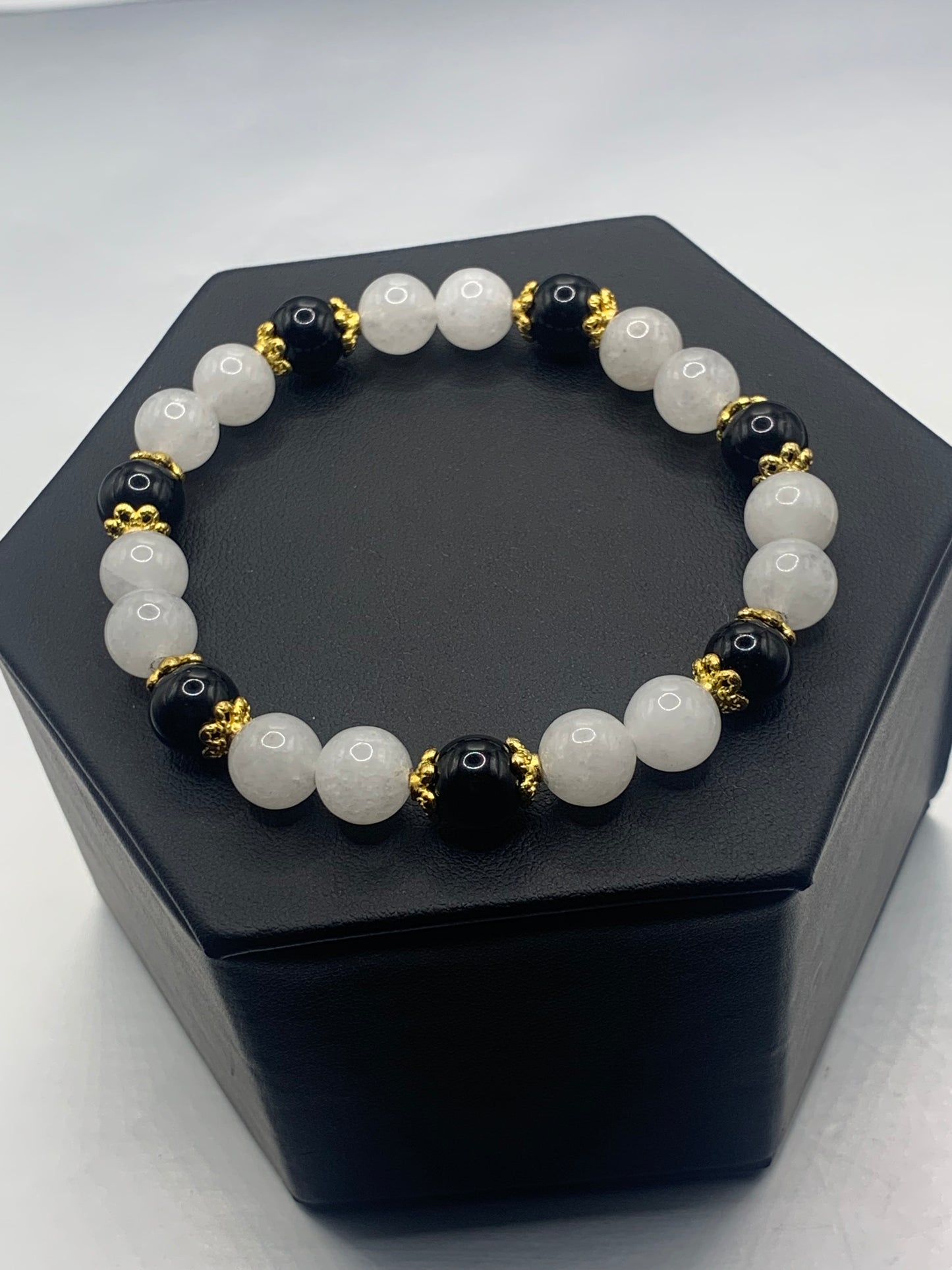 Black obsidian with white chalcedony semi precious stone/crystal beaded elastic bracelet with gold plated flower bead caps