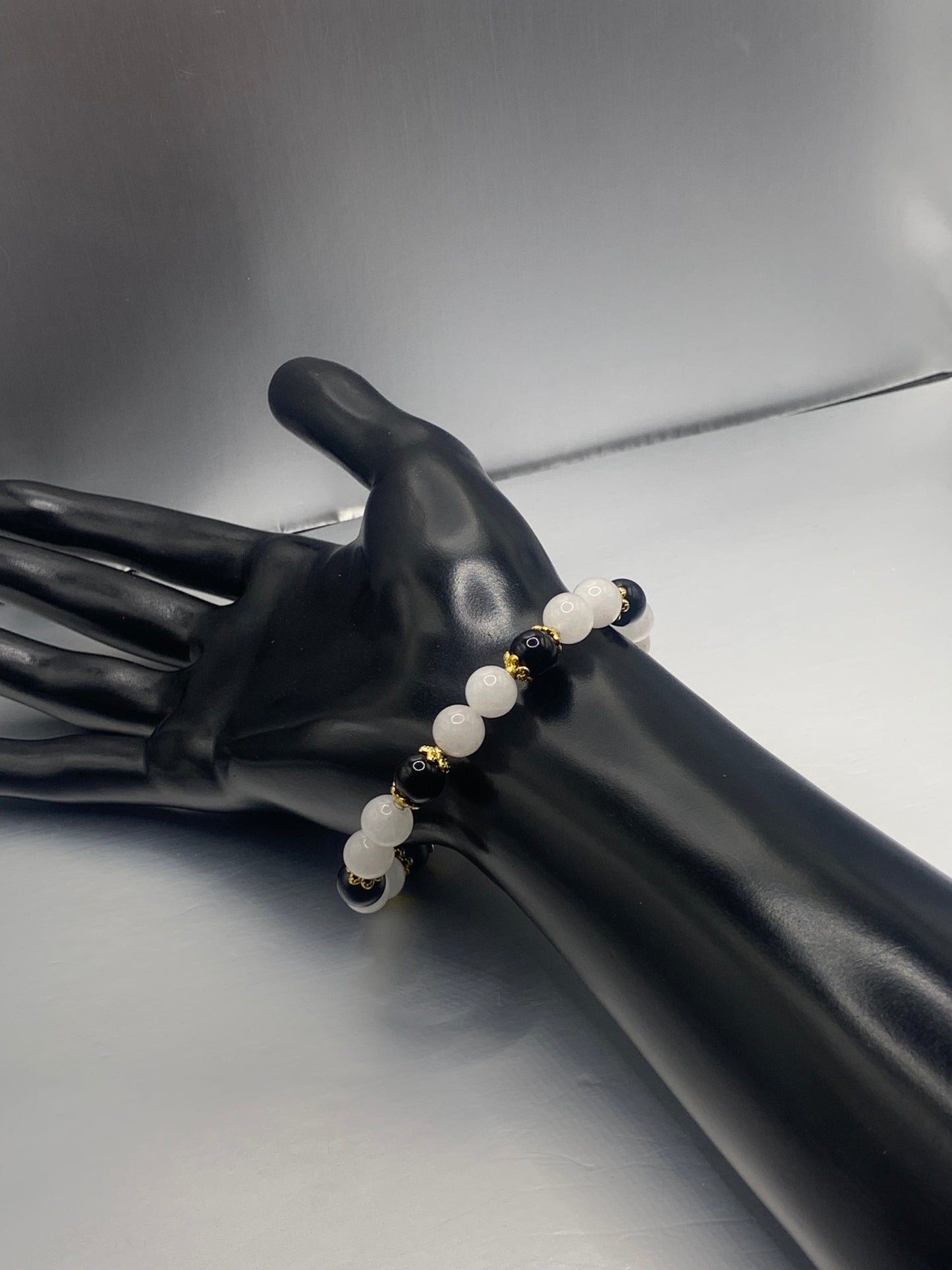 Black obsidian with white chalcedony semi precious stone/crystal beaded elastic bracelet with gold plated flower bead caps