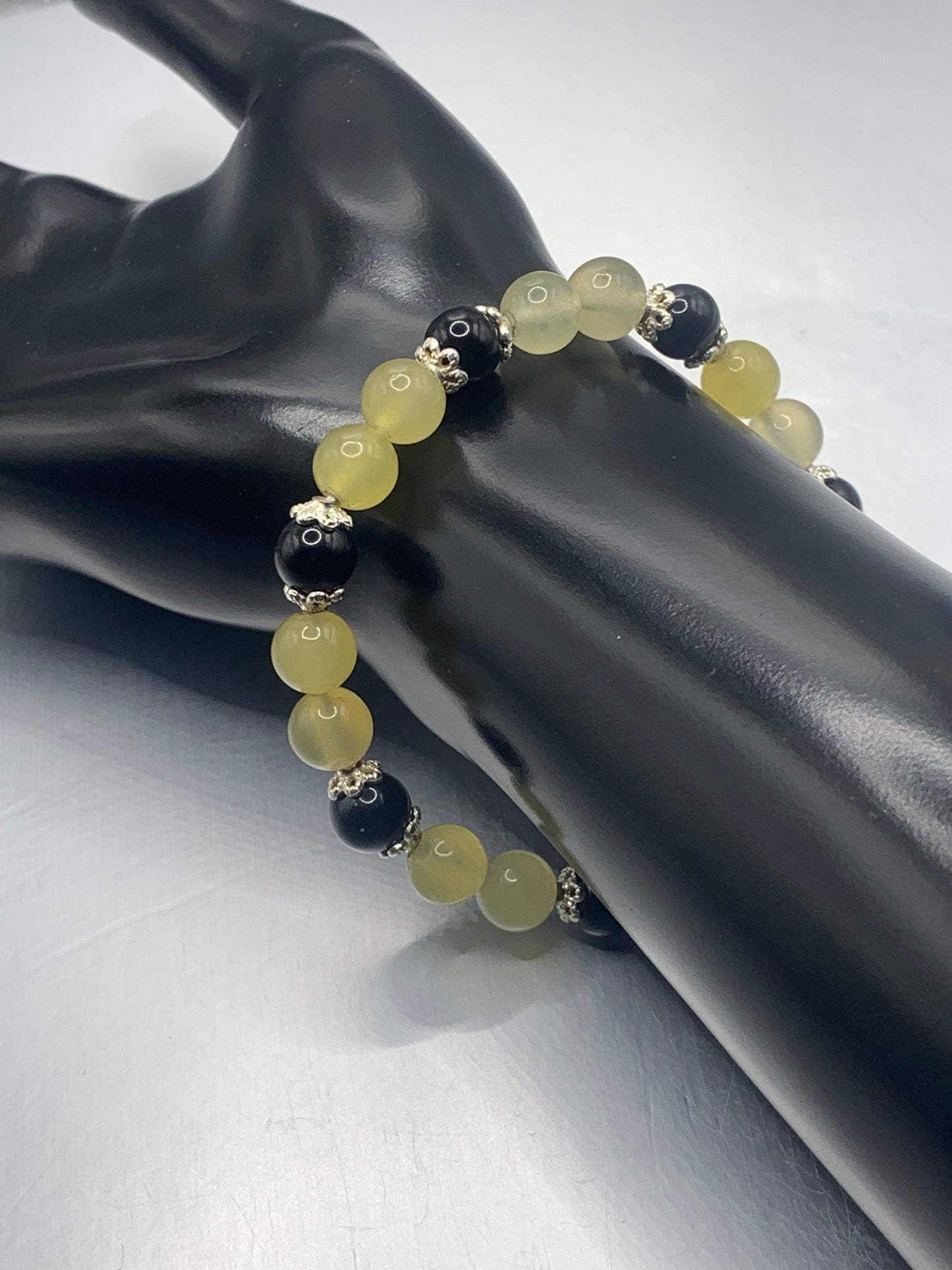Black obsidian with yellow agate semi precious stone/crystal beaded elastic bracelet with silver plated flower bead caps