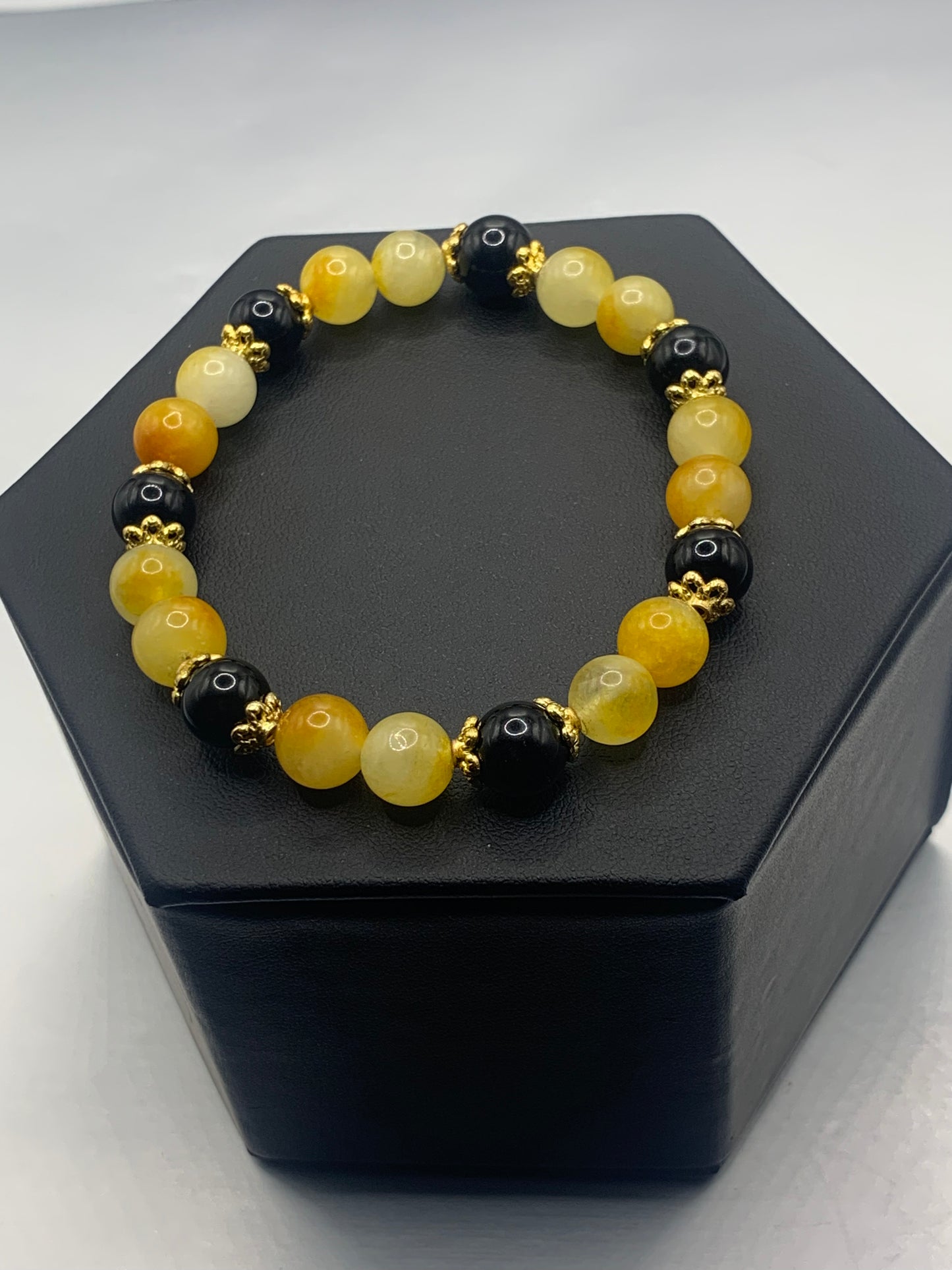 Black obsidian with yellow white chalcedony semi precious stone/crystal beaded elastic bracelet with gold plated flower bead caps