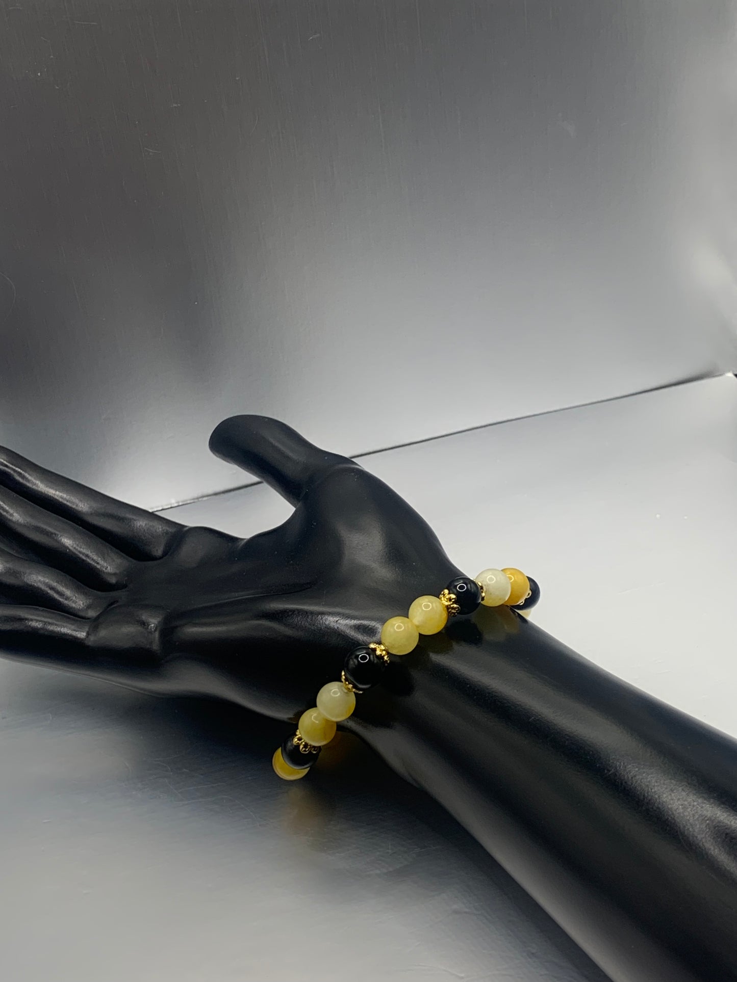 Black obsidian with yellow white chalcedony semi precious stone/crystal beaded elastic bracelet with gold plated flower bead caps