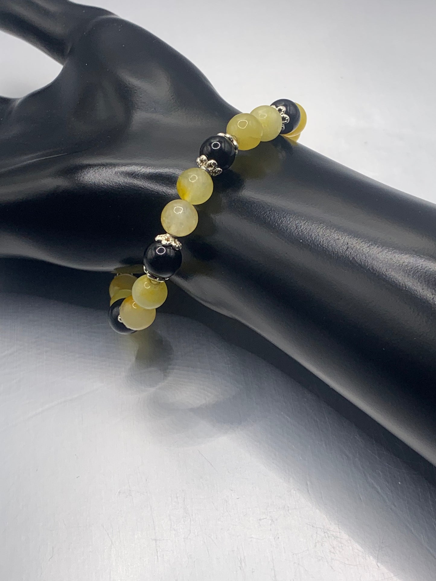 Black obsidian with yellow white chalcedony semi precious stone/crystal beaded elastic bracelet with silver plated flower bead caps