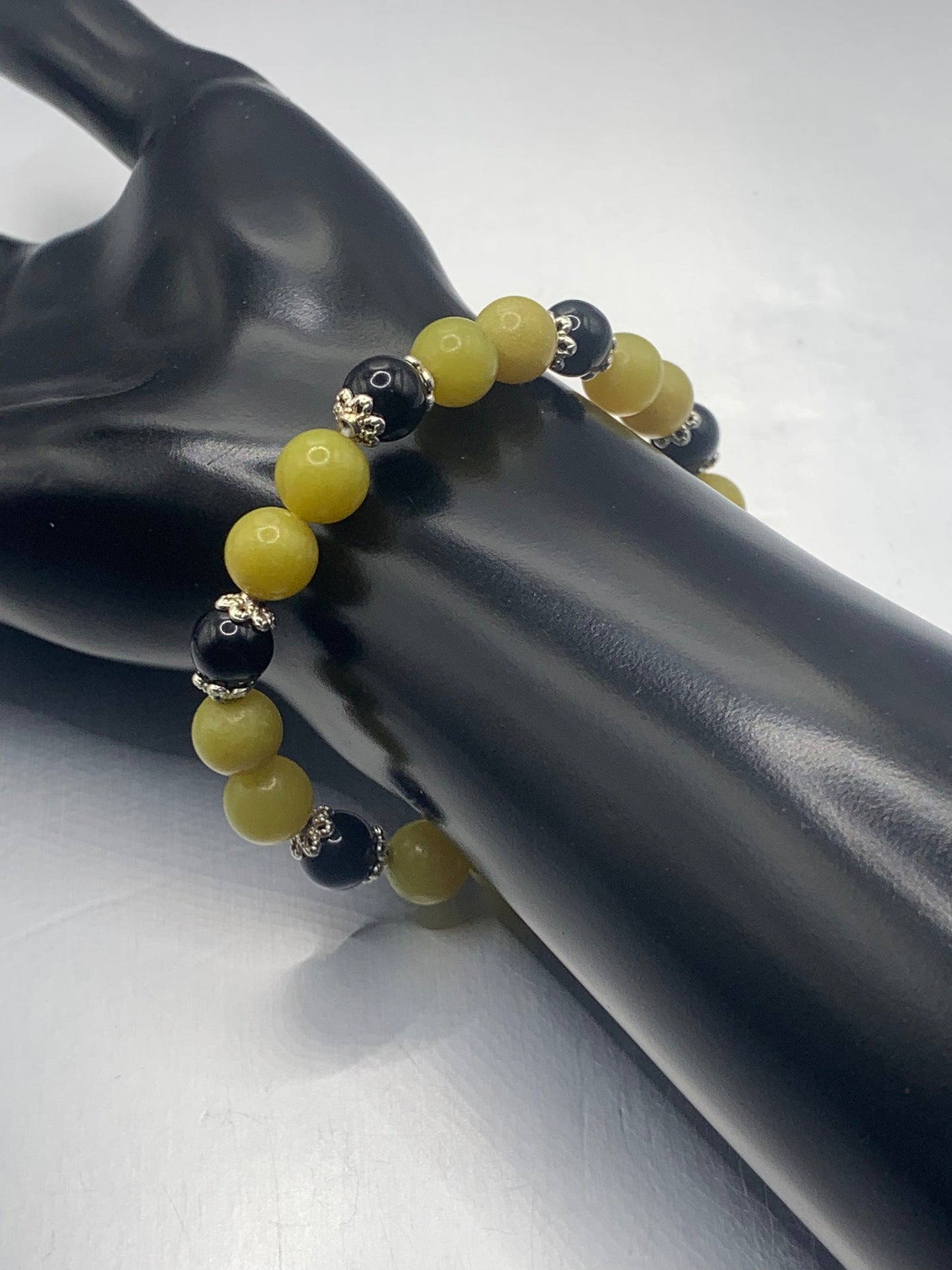 Black obsidian with yellow jade semi precious stone/crystal beaded elastic bracelet with silver plated flower bead caps