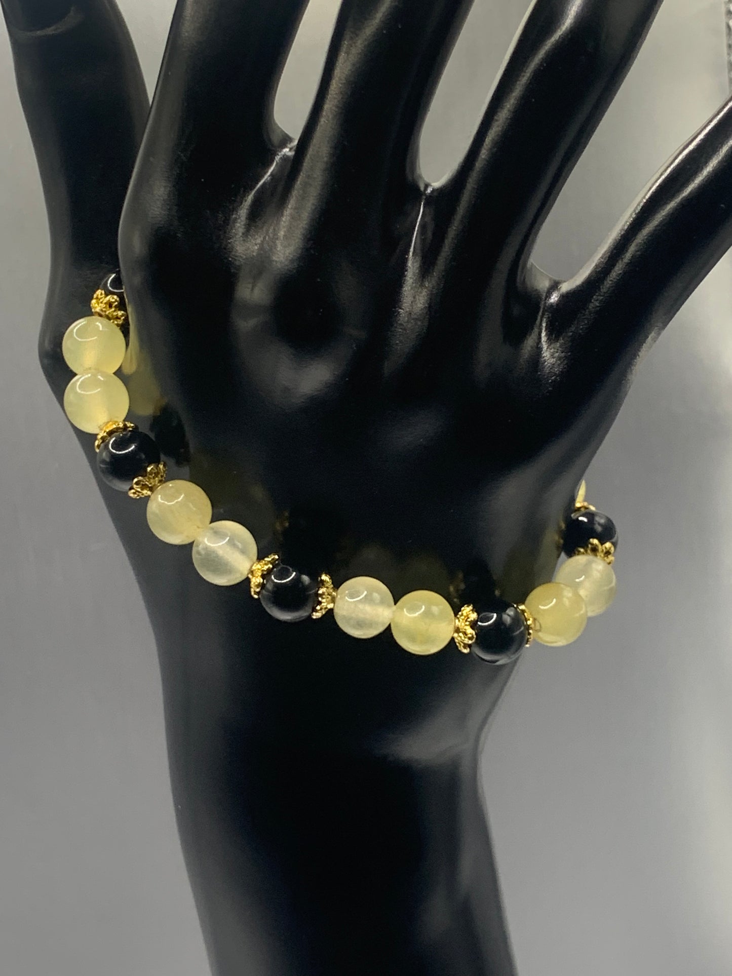Black obsidian with yellow agate semi precious stone/crystal beaded elastic bracelet with gold plated flower bead caps