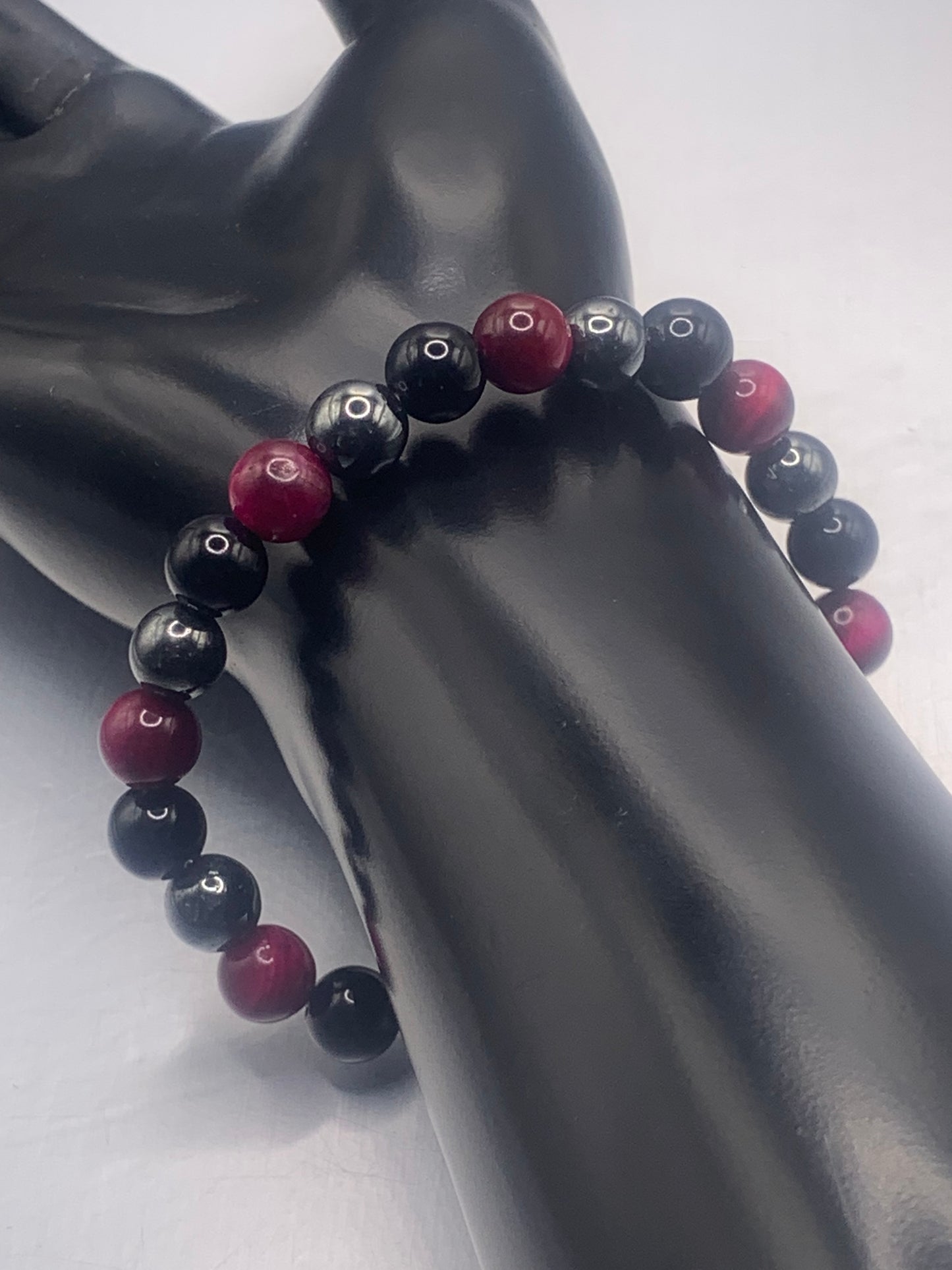 Hematite, black obsidian, and pink tigers eye semi precious stone/crystal elastic beaded bracelet
