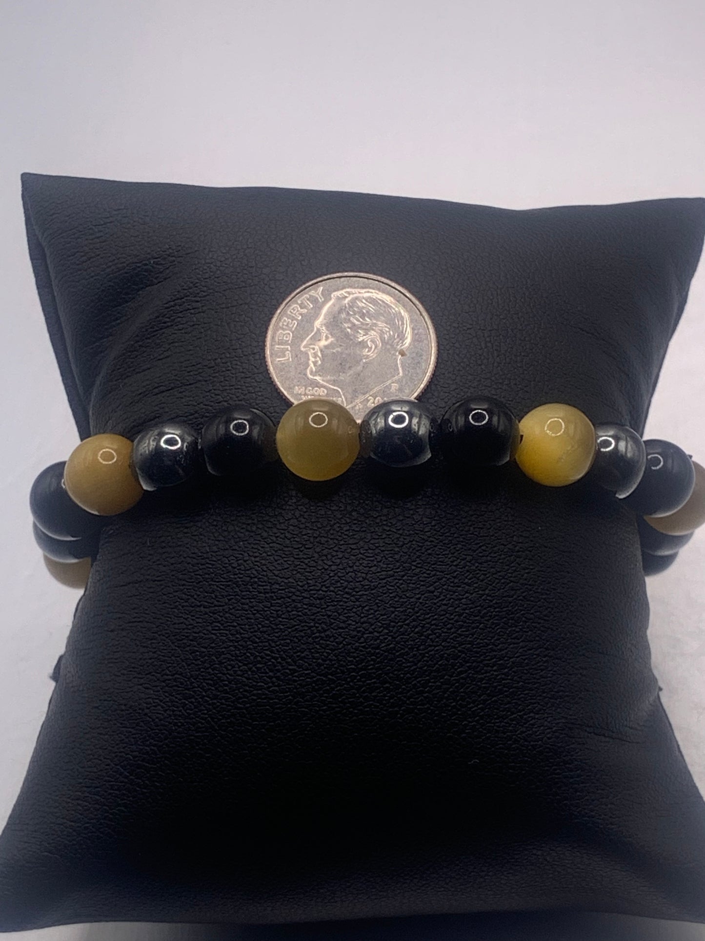 Hematite, black obsidian, and yellow tigers eye semi precious stone/crystal elastic beaded bracelet