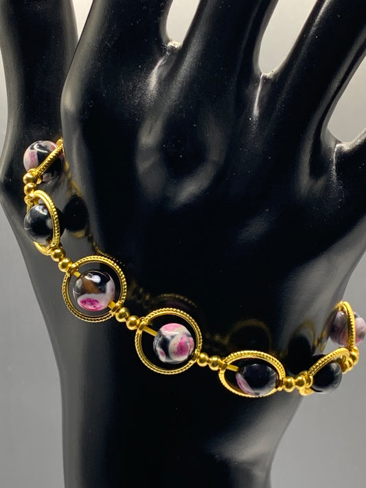 Pink orca agate semi precious stone/crystal elastic beaded bracelet with gold colored rings