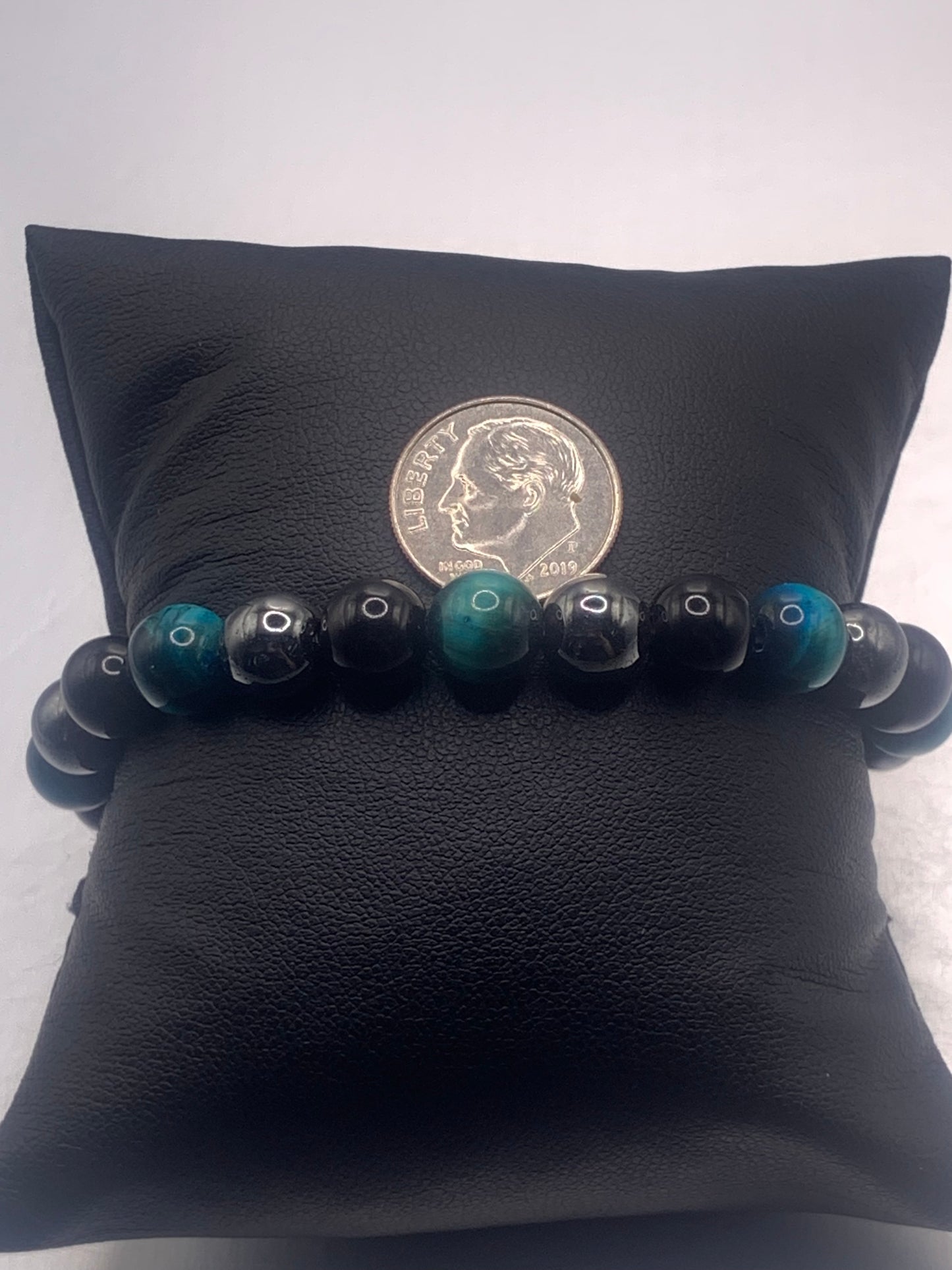 Hematite, black obsidian, and teal blue tigers eye semi precious stone/crystal elastic beaded bracelet