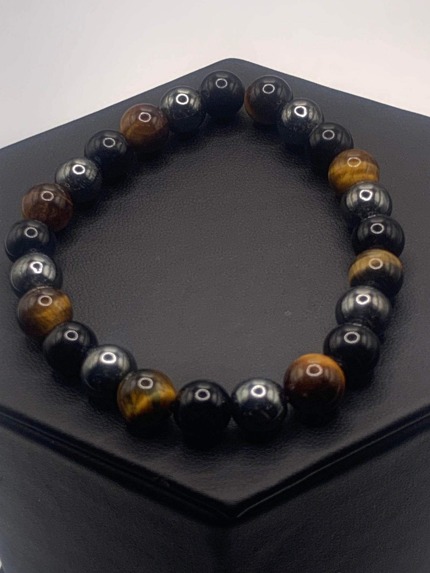 Hematite, black obsidian, and brown tigers eye semi precious stone/crystal elastic beaded bracelet